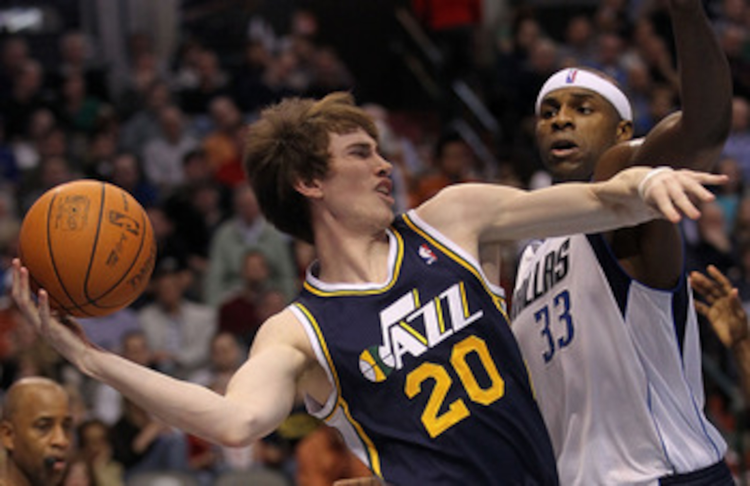 DALLAS, TX - FEBRUARY 23:  Forward Gordon Hayward #20 of the Utah Jazz passes the ball against Brendan Haywood #33 of the Dallas Mavericks at American Airlines Center on February 23, 2011 in Dallas, Texas.  NOTE TO USER: User expressly acknowledges and ag