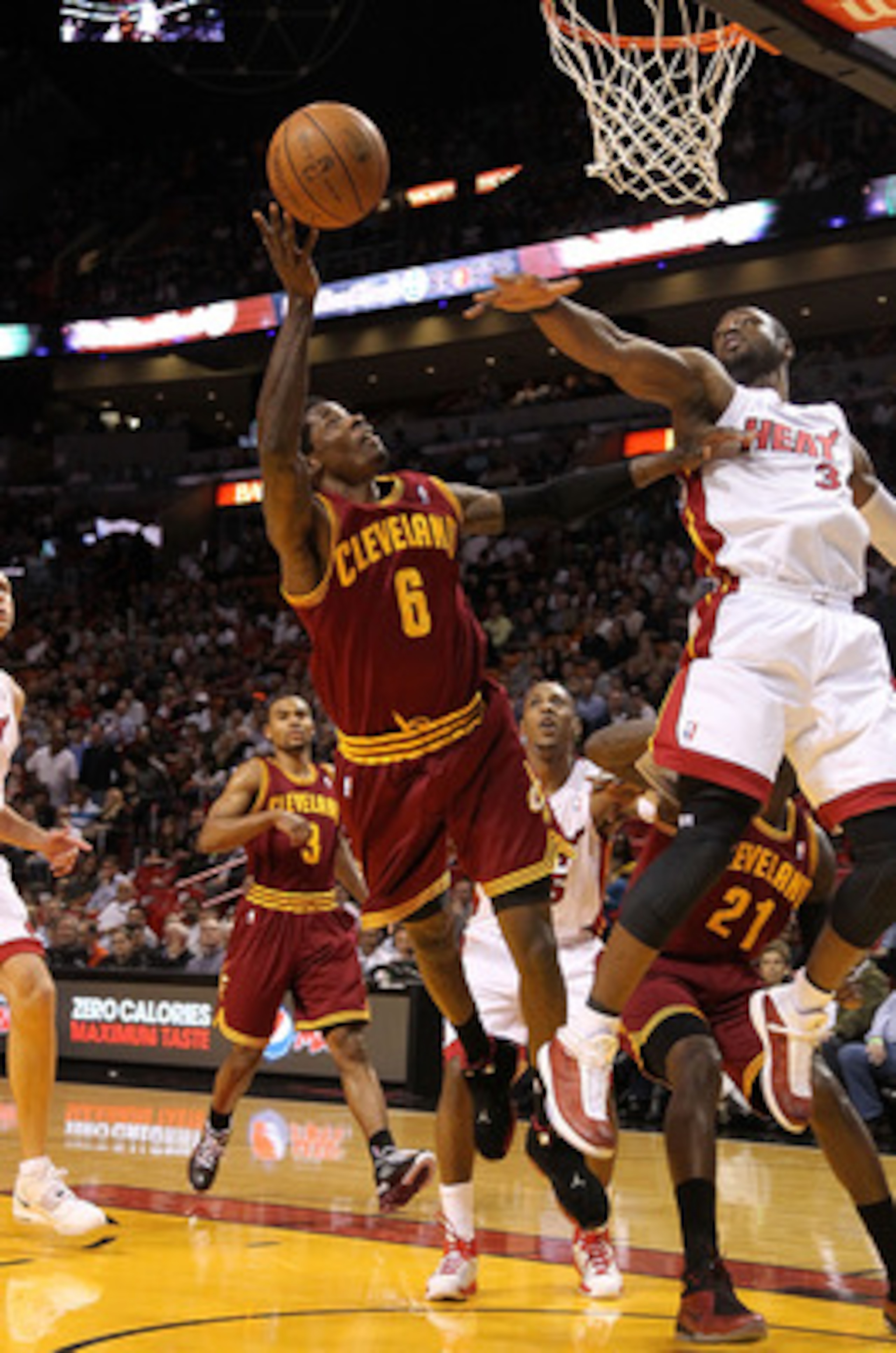 MIAMI, FL - JANUARY 31:  Manny Harris #6 of the  Cleveland Cavaliers shoots over Dwyane Wade #3 of the Miami Heat during a game against at American Airlines Arena on January 31, 2011 in Miami, Florida. NOTE TO USER: User expressly acknowledges and agrees