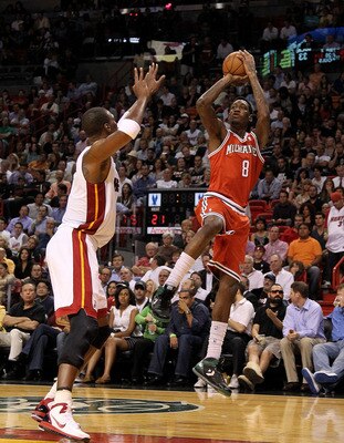 MIAMI, FL - APRIL 06:  Larry Sanders #8 of the Milwaukee Bucks shoots over Chris Bosh #1 of the Miami Heat during a game at American Airlines Arena on April 6, 2011 in Miami, Florida. NOTE TO USER: User expressly acknowledges and agrees that, by downloadi