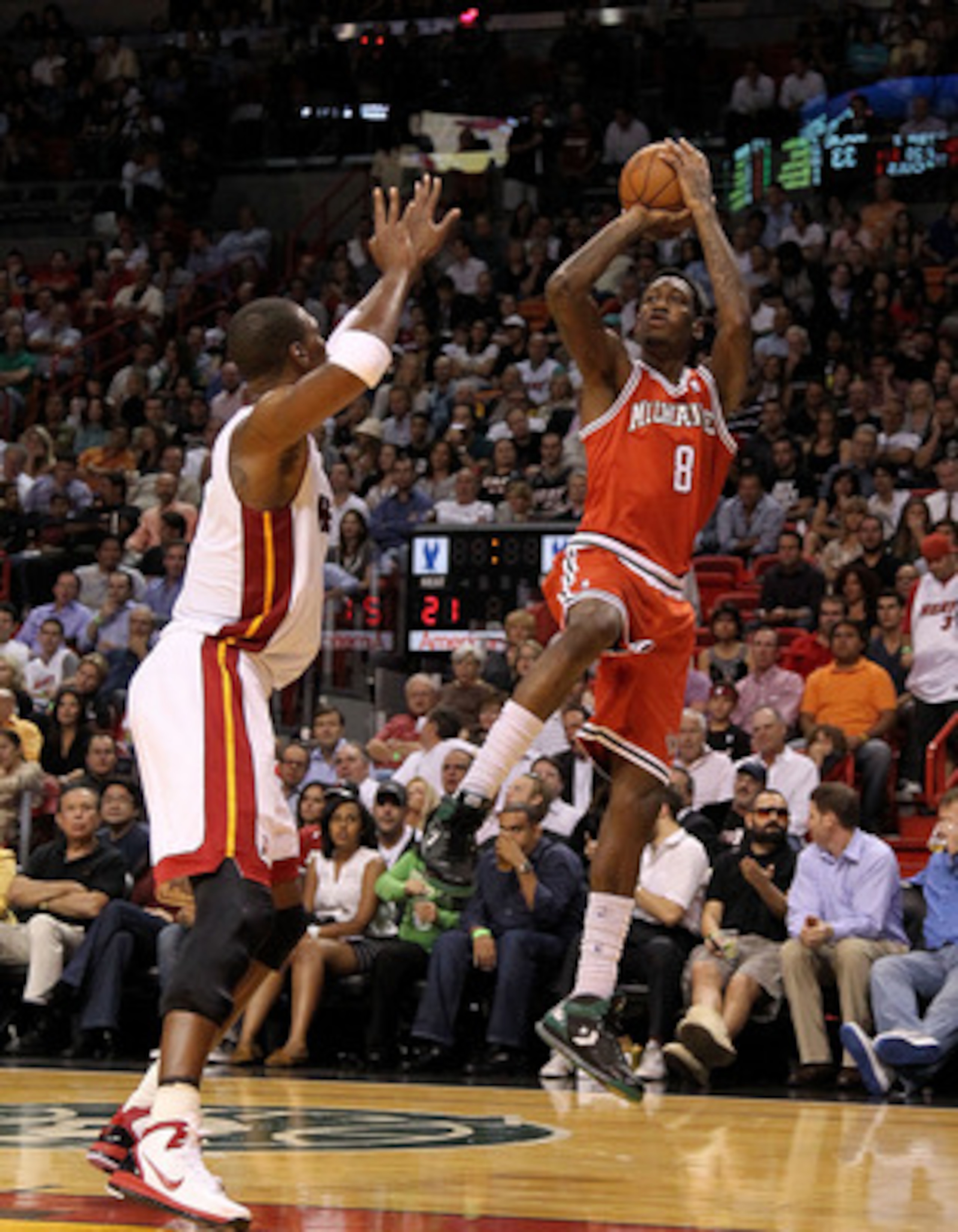 MIAMI, FL - APRIL 06:  Larry Sanders #8 of the Milwaukee Bucks shoots over Chris Bosh #1 of the Miami Heat during a game at American Airlines Arena on April 6, 2011 in Miami, Florida. NOTE TO USER: User expressly acknowledges and agrees that, by downloadi