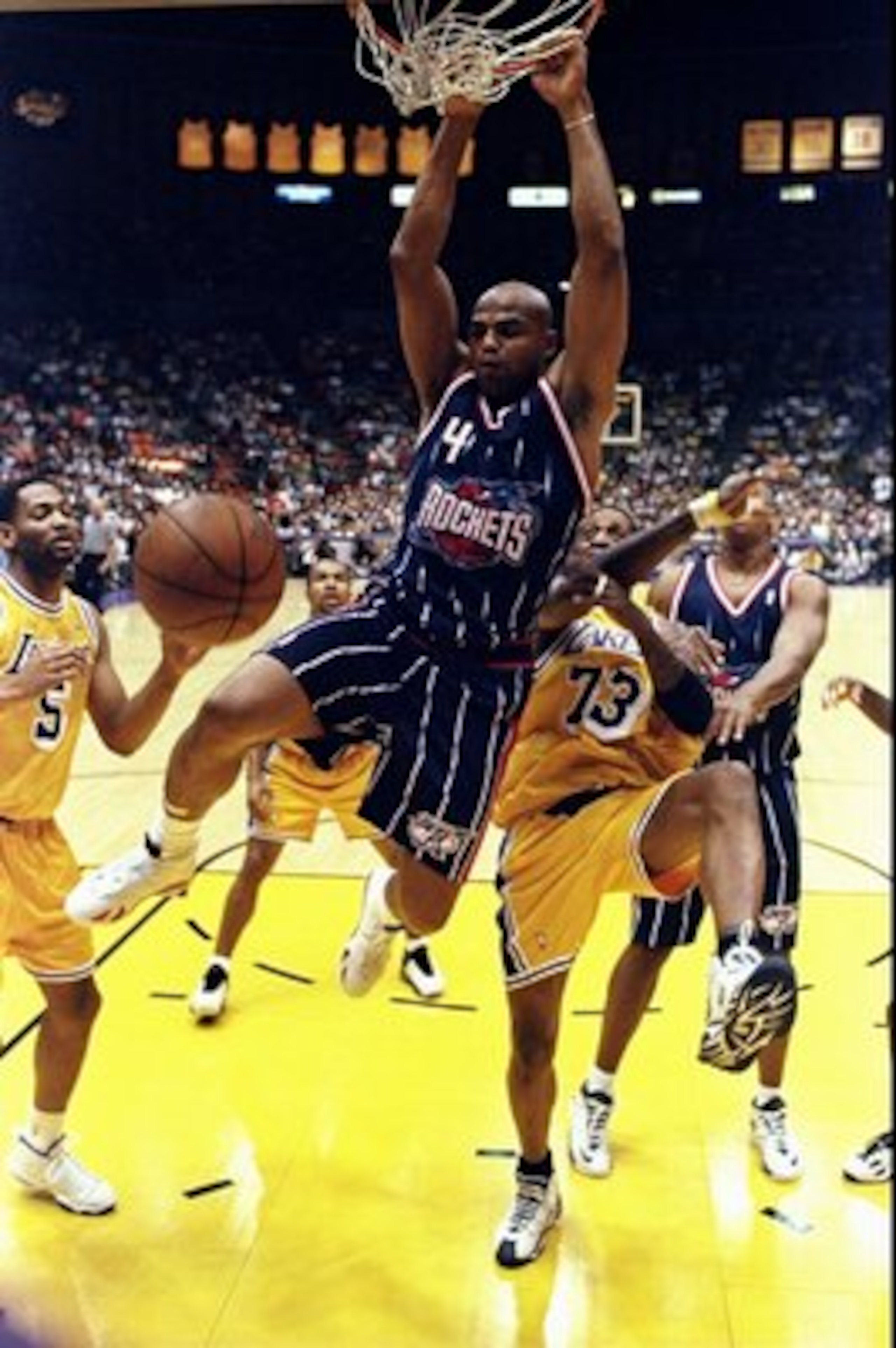 28 Feb 1999: Charles Barkley #4 of the Houston Rockets hangs from the hoop during the game against the Los Angeles Lakers at the Great Western Forum in Inglewood, California. The Lakers defeated the Rockets 106-90.    Mandatory Credit: Elsa Hasch  /Allspo