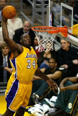 LOS ANGELES - MARCH 5: Shaquille O'Neal #34 of the Los Angeles Lakers slam dunks during the game against the Seattle Sonics at Staples Center on March 5, 2004 in Los Angeles, California. NOTE TO USER: User expressly acknowledges and agrees that, by dow LOS ANGELES - MARCH 5: Shaquille O'Neal #34 of the Los Angeles Lakers slam dunks during the game against the Seattle Sonics at Staples Center on March 5, 2004 in Los Angeles, California. NOTE TO USER: User expressly acknowledges and agrees that, by dow