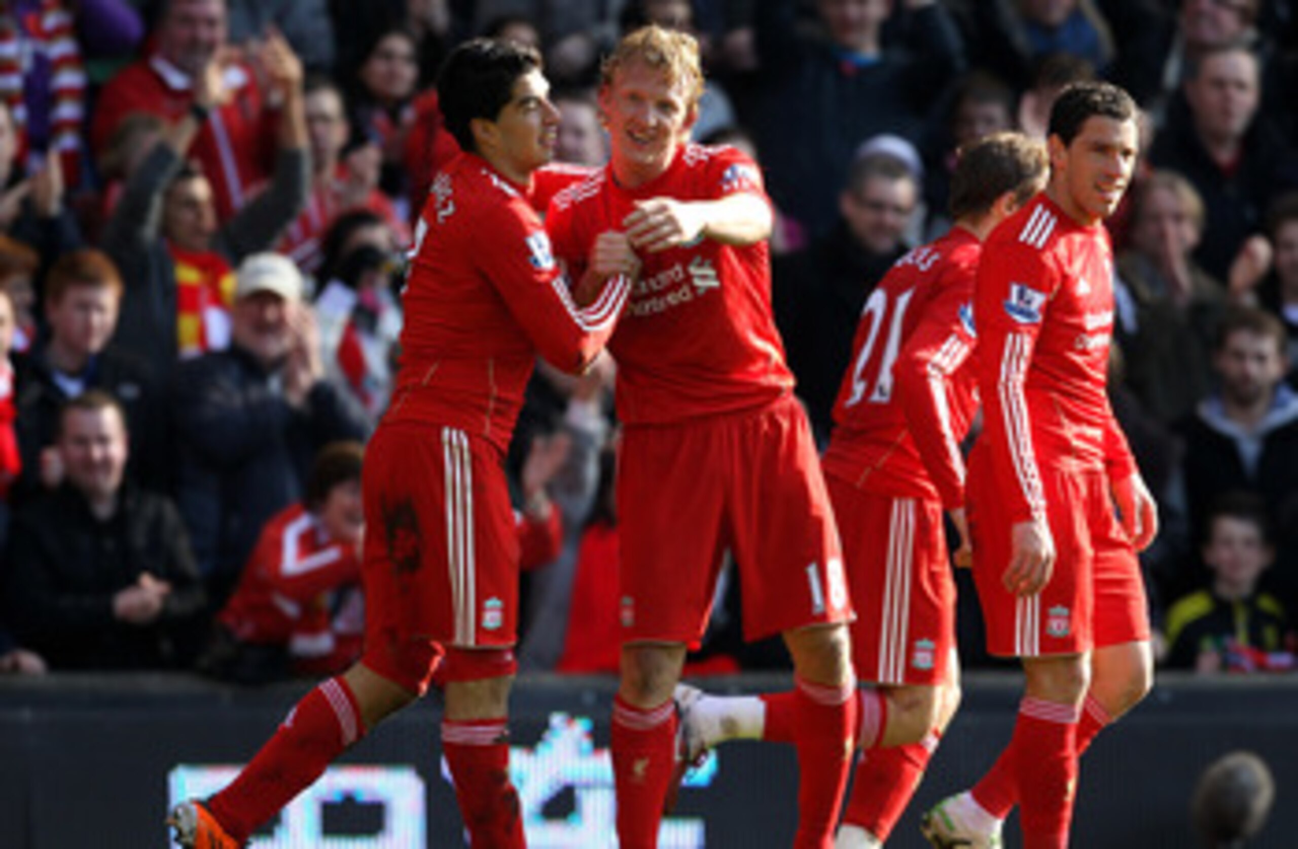 LIVERPOOL, ENGLAND - MARCH 06:  Dirk Kuyt of Liverpool celebrates scoring the opening goal with team mate Luis Suarez (L) during the Barclays Premier League match between Liverpool and Manchester United at Anfield on March 6, 2011 in Liverpool, England.