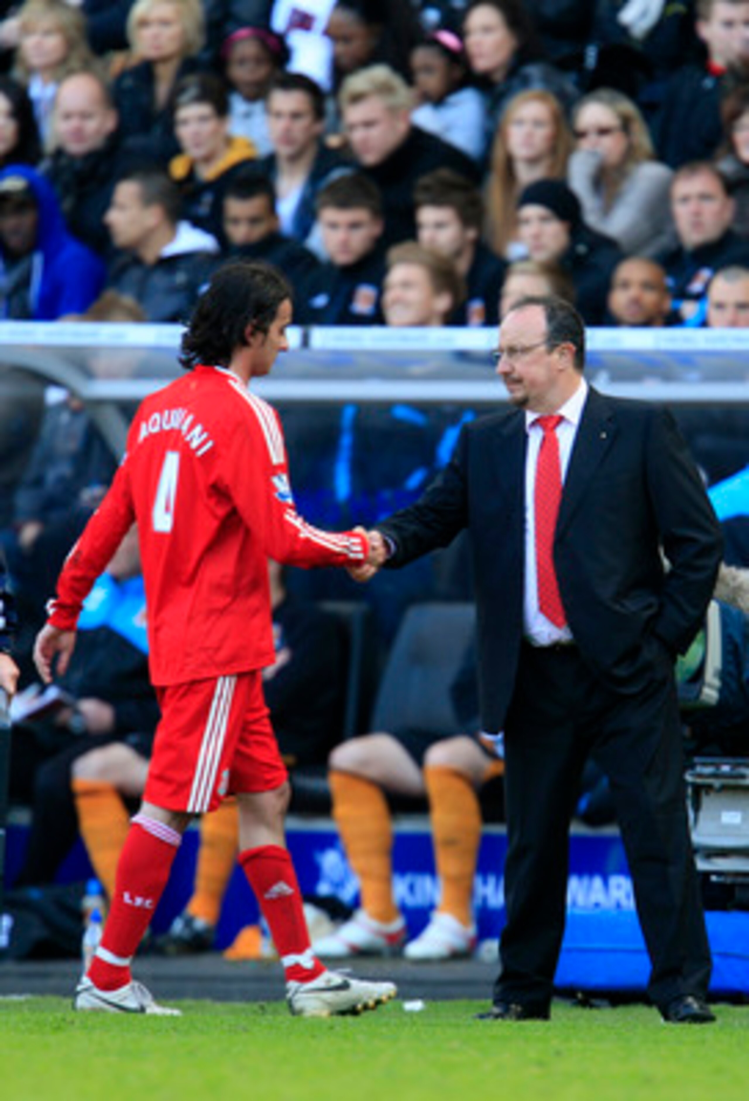 HULL, ENGLAND - MAY 9:  Alberto Aquilani of Liverpool shakes hands with manager Rafael Benitez as he is substituted during the Barclays Premier League match between Hull City and Liverpool at the KC Stadium on May 9, 2010 in Hull, England. (Photo by Jed L
