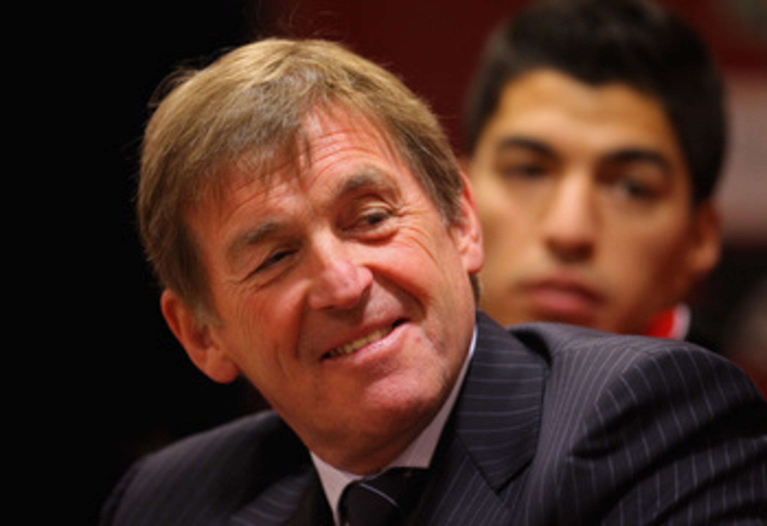 LIVERPOOL, ENGLAND - FEBRUARY 03:  Kenny Dalglish the manager of Liverpool and new signing Luis Suarez look on as they face the media during a press conference at Anfield on February 3, 2011 in Liverpool, England.  (Photo by Alex Livesey/Getty Images)