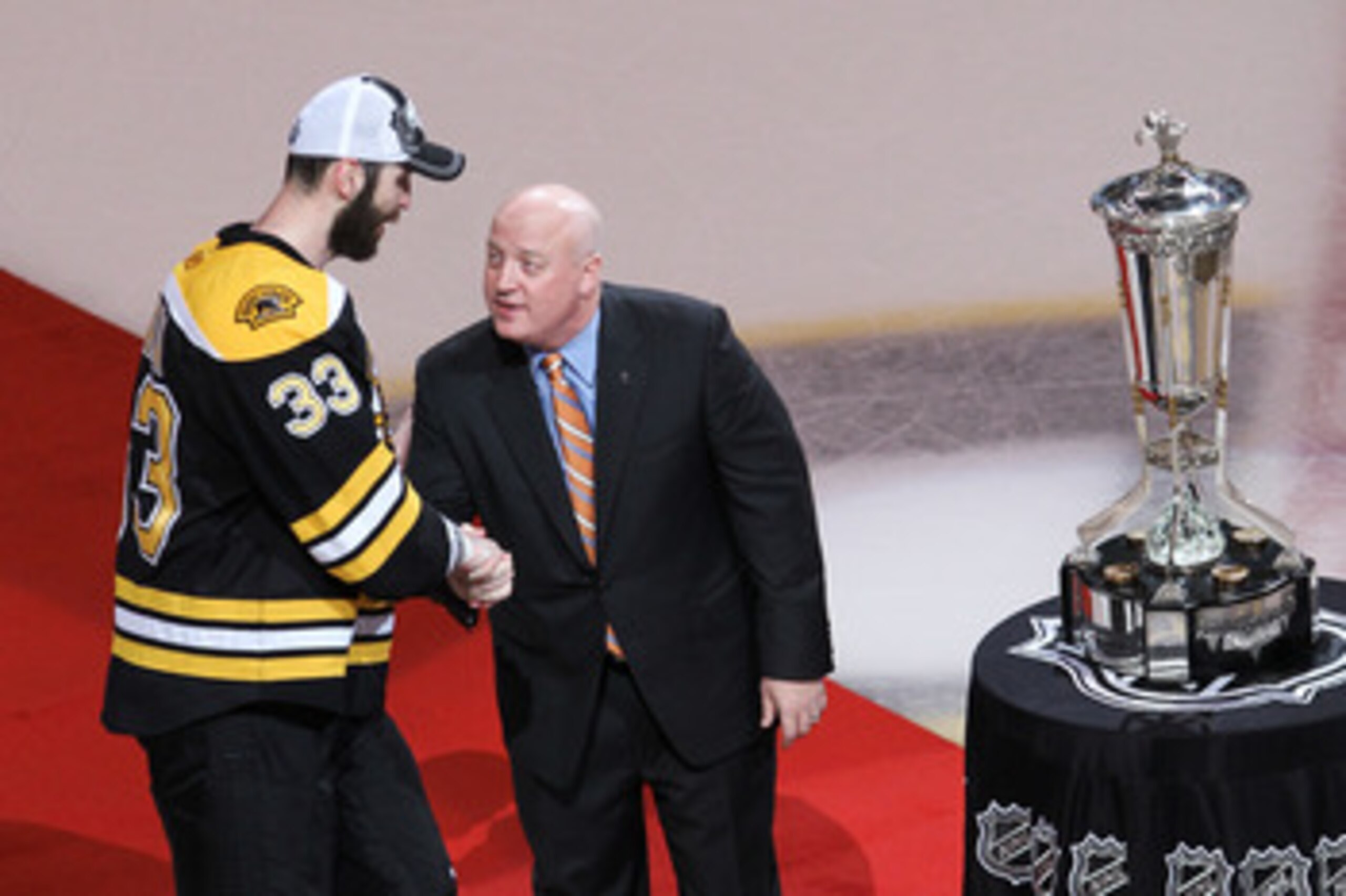 BOSTON, MA - MAY 27:  Deputy Commissioner Bill Daly shakes the hand of Zdeno Chara #33 of the Boston Bruins as he presents them The Prince of Wales trophy after they defeated the Tampa Bay Lightning 1 to 0 in Game Seven of the Eastern Conference Finals du