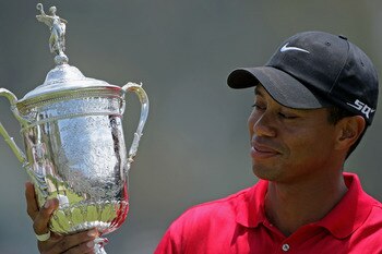 SAN DIEGO - JUNE 16:  Tiger Woods celebrates with the trophy after winning on the first sudden death playoff hole during the playoff round of the 108th U.S. Open at the Torrey Pines Golf Course (South Course) on June 16, 2008 in San Diego, California.  (P