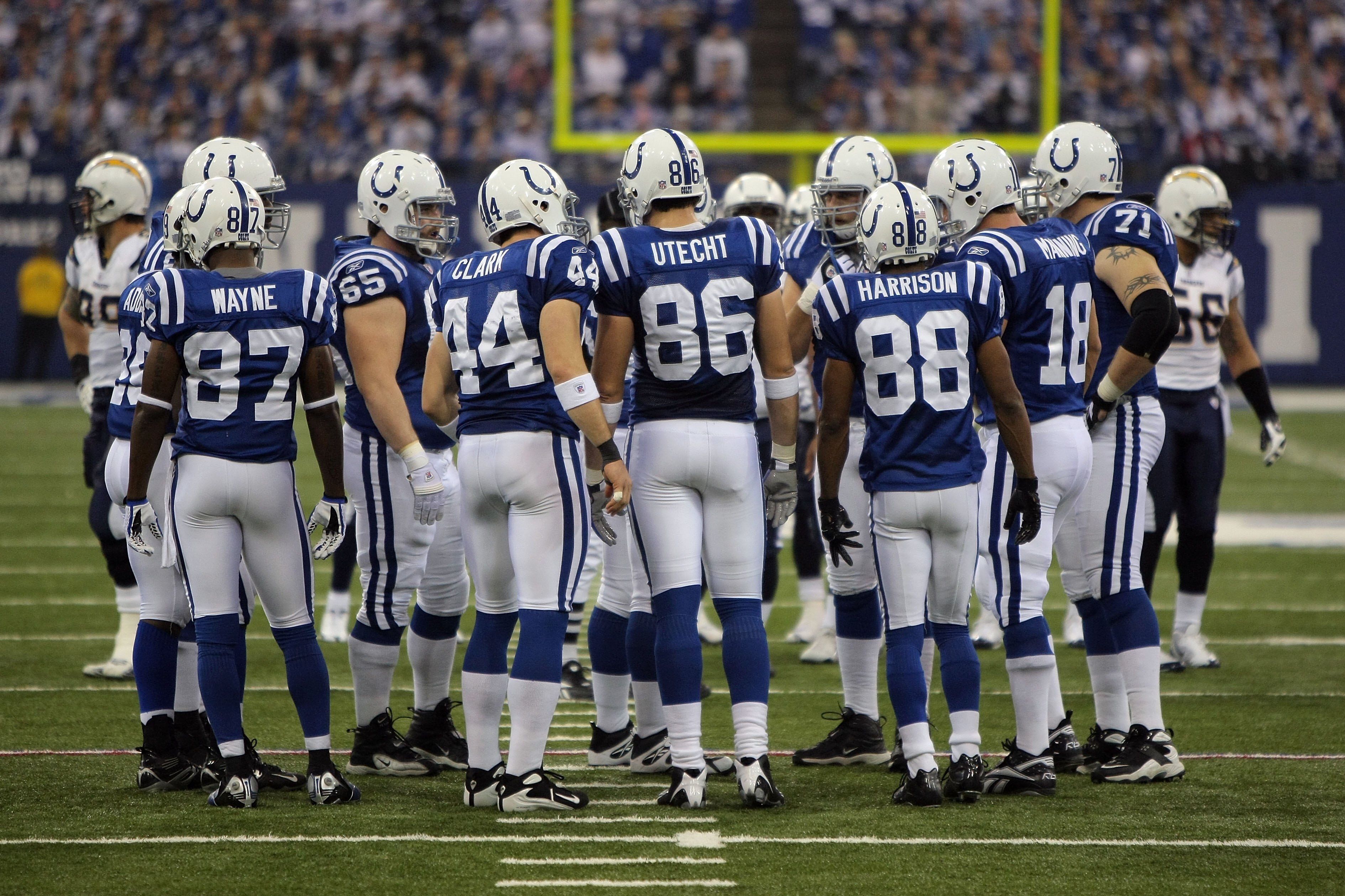 INDIANAPOLIS - JANUARY 13:  Reggie Wayne #87, Dallas Clark #44, Ben Utecht #86, Marvin Harrison #88 and Peyton Manning #18 of the Indianapolis Colts stand in the offensive huddle against the San Diego Chargers during their AFC Divisional Playoff game at t