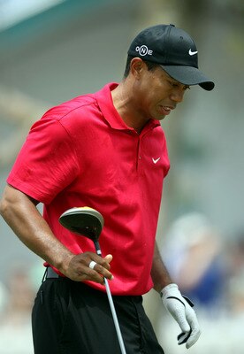 SAN DIEGO - JUNE 15:  Tiger Woods reacts to pain in his left knee after his tee shot on the second hole during the final round of the 108th U.S. Open at the Torrey Pines Golf Course (South Course) on June 15, 2008 in San Diego, California.  (Photo by Dona