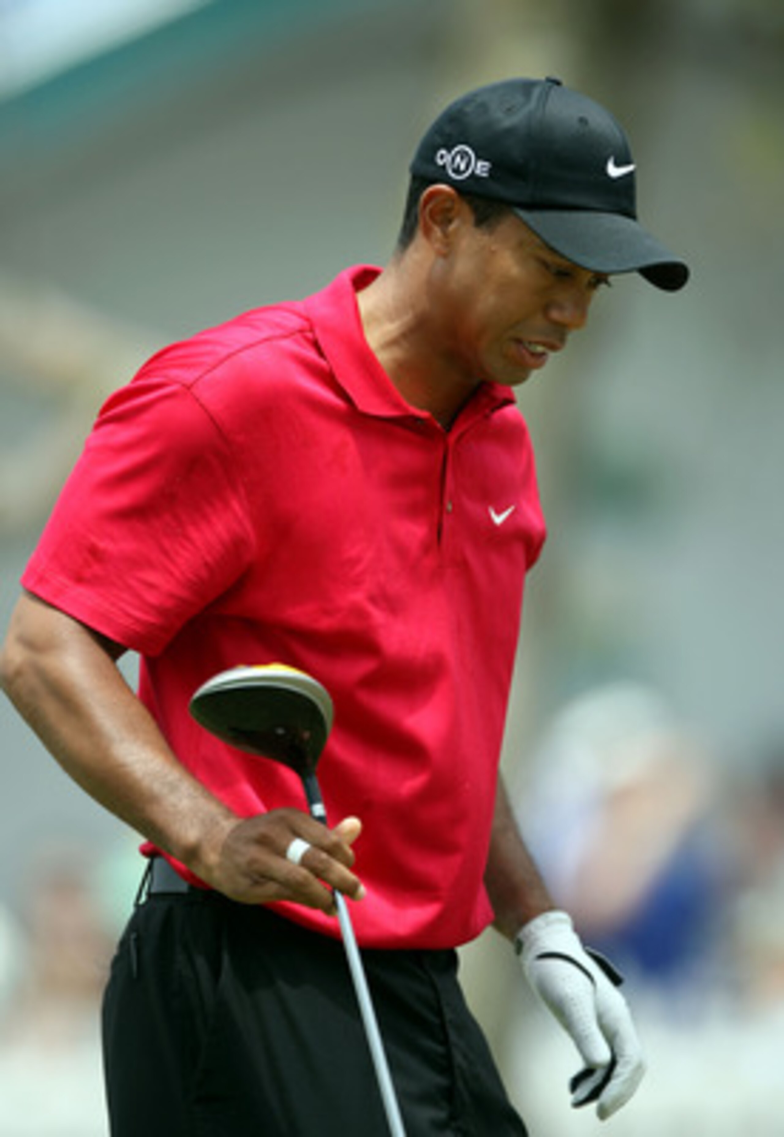 SAN DIEGO - JUNE 15:  Tiger Woods reacts to pain in his left knee after his tee shot on the second hole during the final round of the 108th U.S. Open at the Torrey Pines Golf Course (South Course) on June 15, 2008 in San Diego, California.  (Photo by Dona