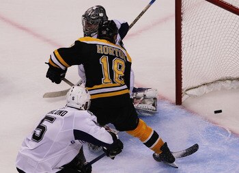 BOSTON, MA - MAY 27:  Nathan Horton #18 of the Boston Bruins scores a third period goal past Dwayne Roloson #35 of the Tampa Bay Lightning in Game Seven of the Eastern Conference Finals during the 2011 NHL Stanley Cup Playoffs at TD Garden on May 27, 2011