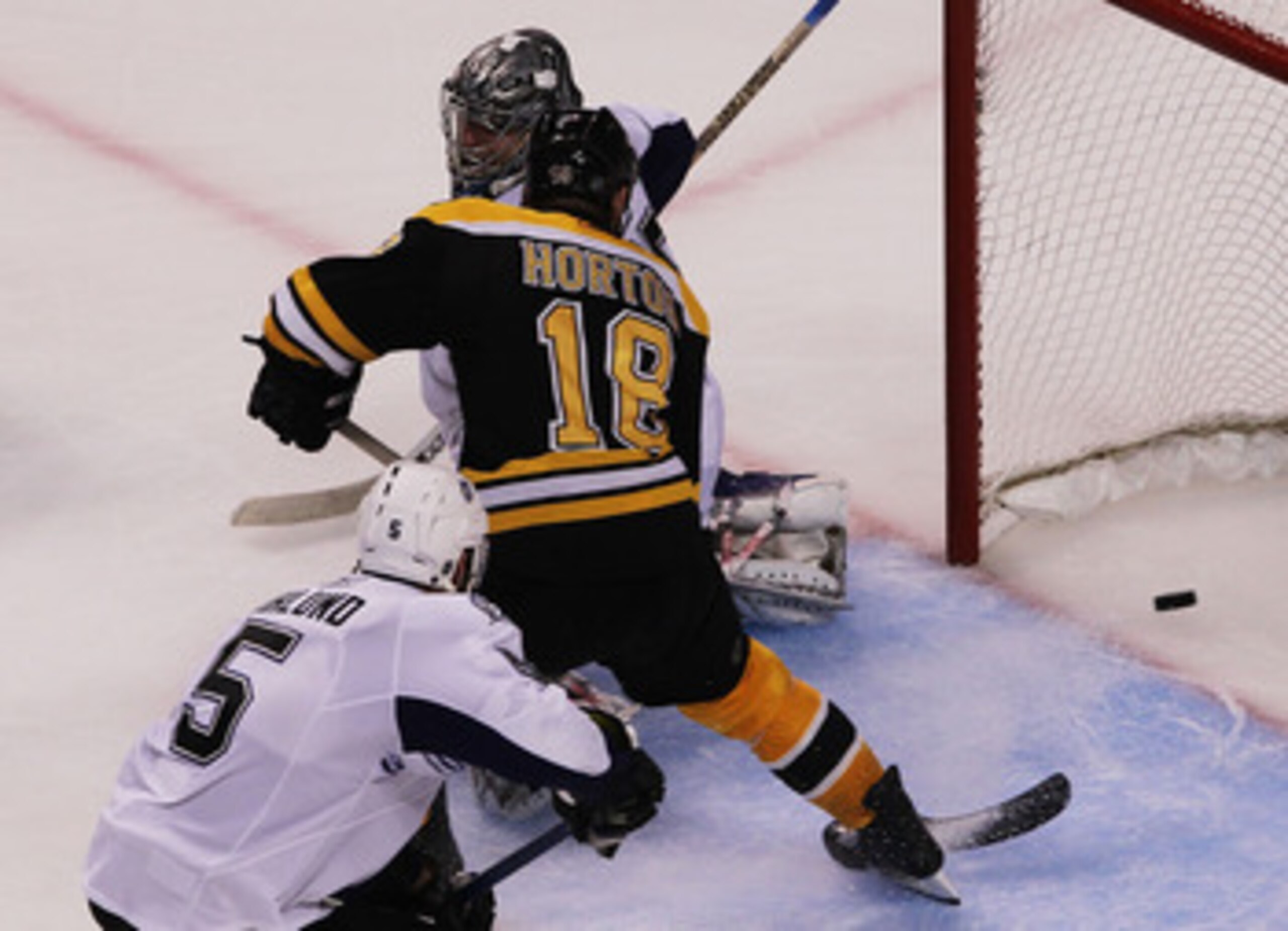 BOSTON, MA - MAY 27:  Nathan Horton #18 of the Boston Bruins scores a third period goal past Dwayne Roloson #35 of the Tampa Bay Lightning in Game Seven of the Eastern Conference Finals during the 2011 NHL Stanley Cup Playoffs at TD Garden on May 27, 2011
