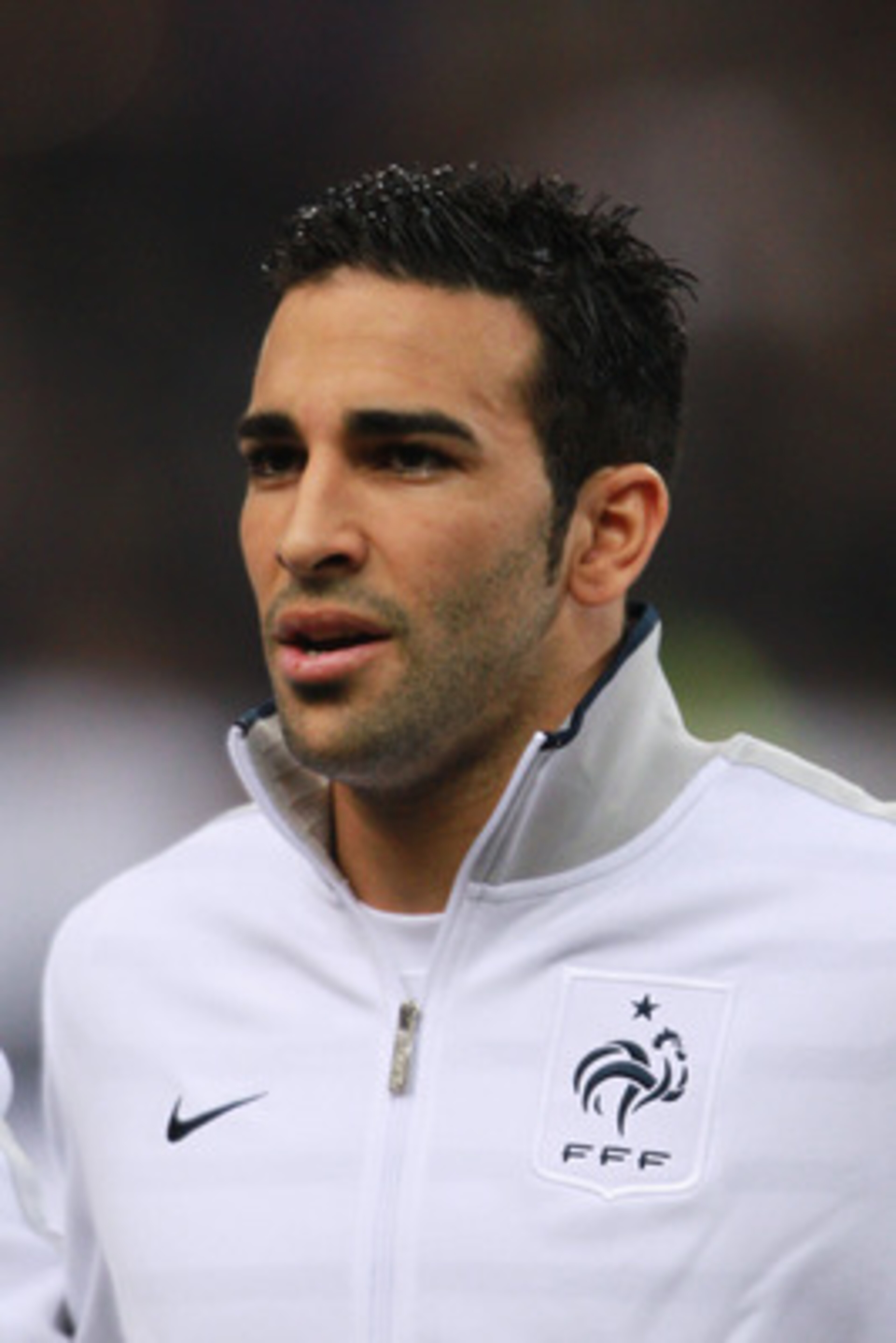PARIS, FRANCE - MARCH 29:  Adil Rami of France sings the national anthem during the International friendly match between France and Croatia at Stade de France on March 29, 2011 in Paris, France.  (Photo by Dean Mouhtaropoulos/Getty Images)