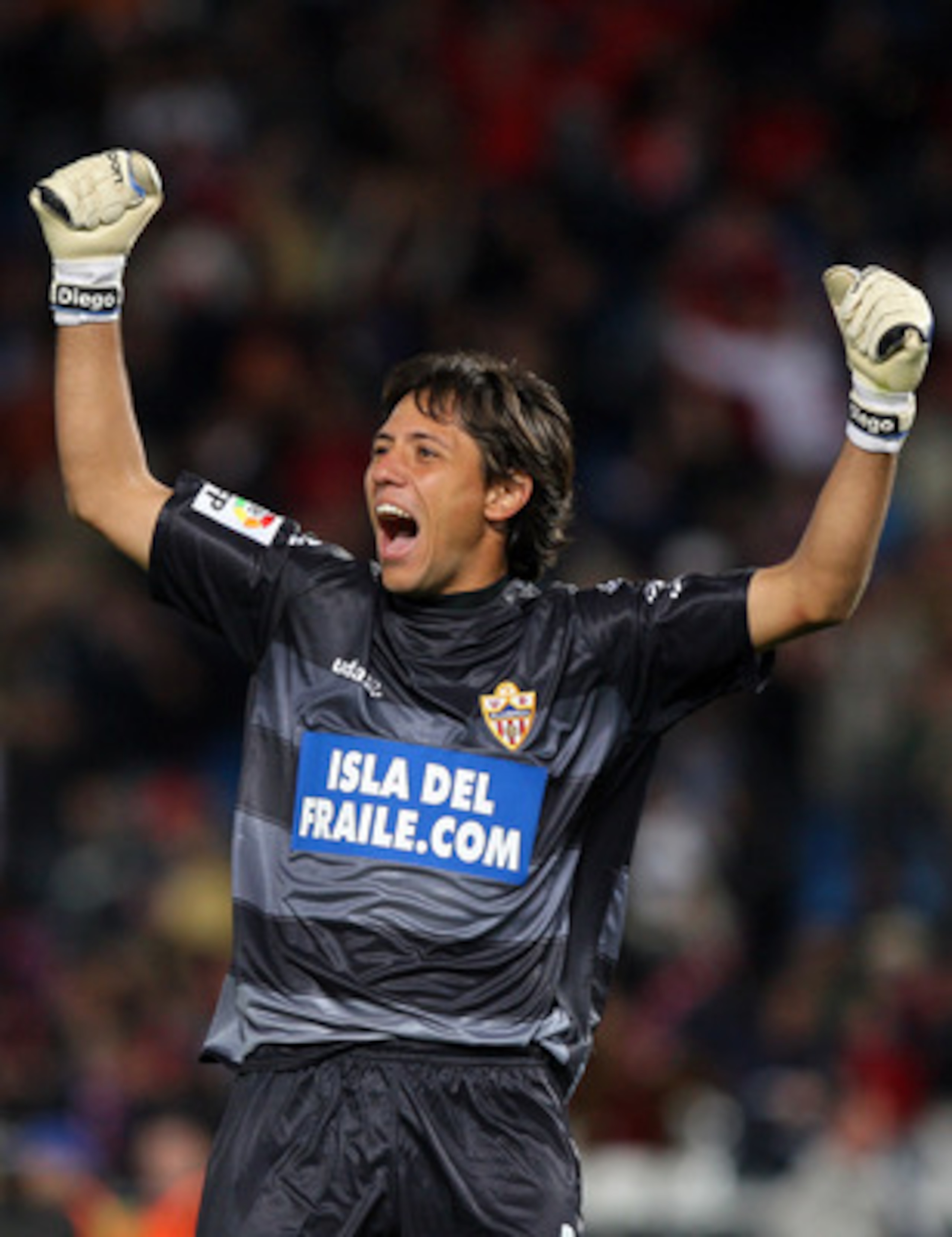 ALMERIA, SPAIN - NOVEMBER 02:  Goalkeeper Diego Alves Carreiza of Almeria celebrates the equalizer scored by his teammate Pablo Piatti during the La Liga match between Almeria and Real Madrid at the Estadio de los Juegos Mediterraneos on November 2, 2008