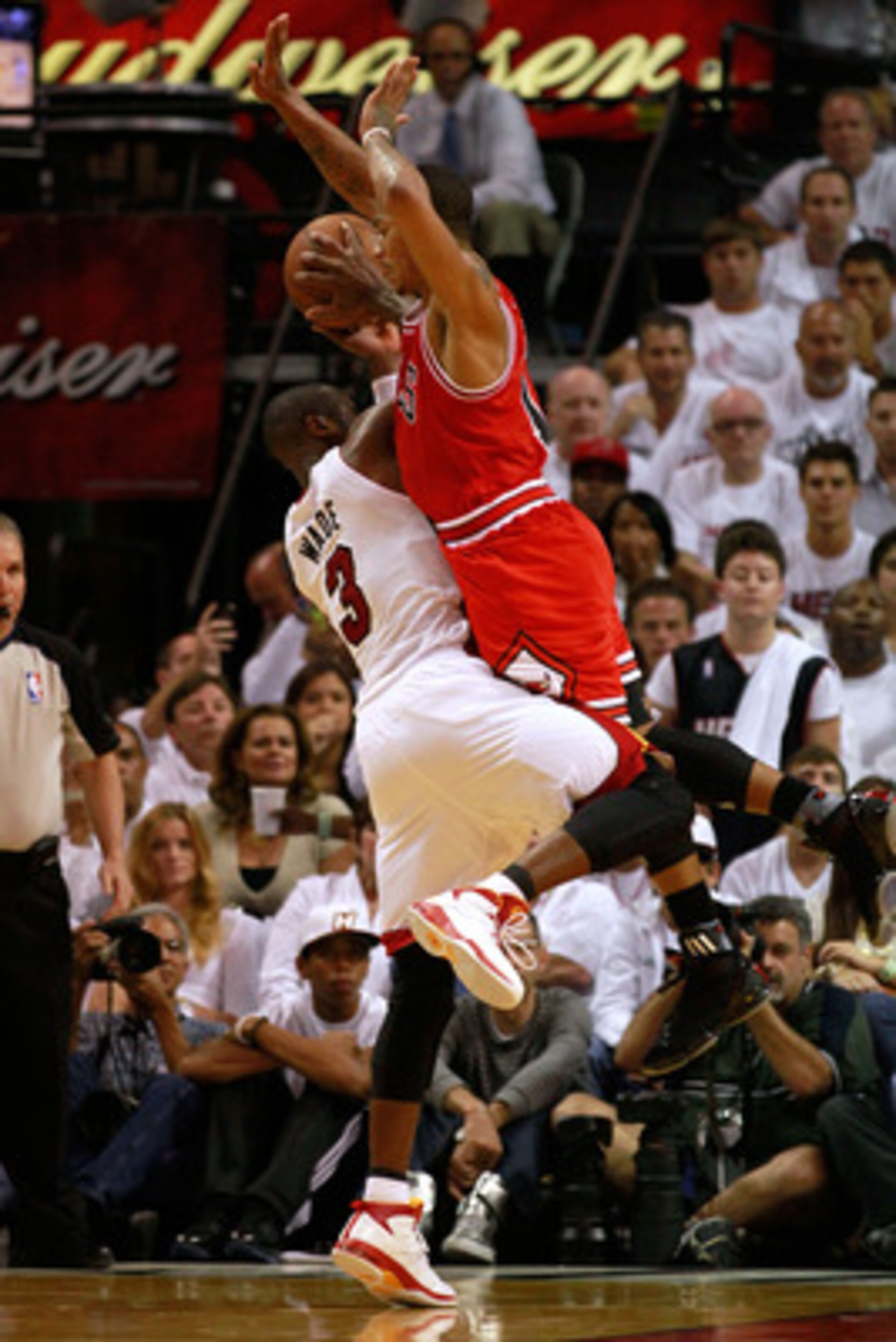 MIAMI, FL - MAY 22:  Dwyane Wade #3 of the Miami Heat attempts a shot against Derrick Rose #1 of the Chicago Bulls in Game Three of the Eastern Conference Finals during the 2011 NBA Playoffs on May 22, 2011 at American Airlines Arena in Miami, Florida.  N