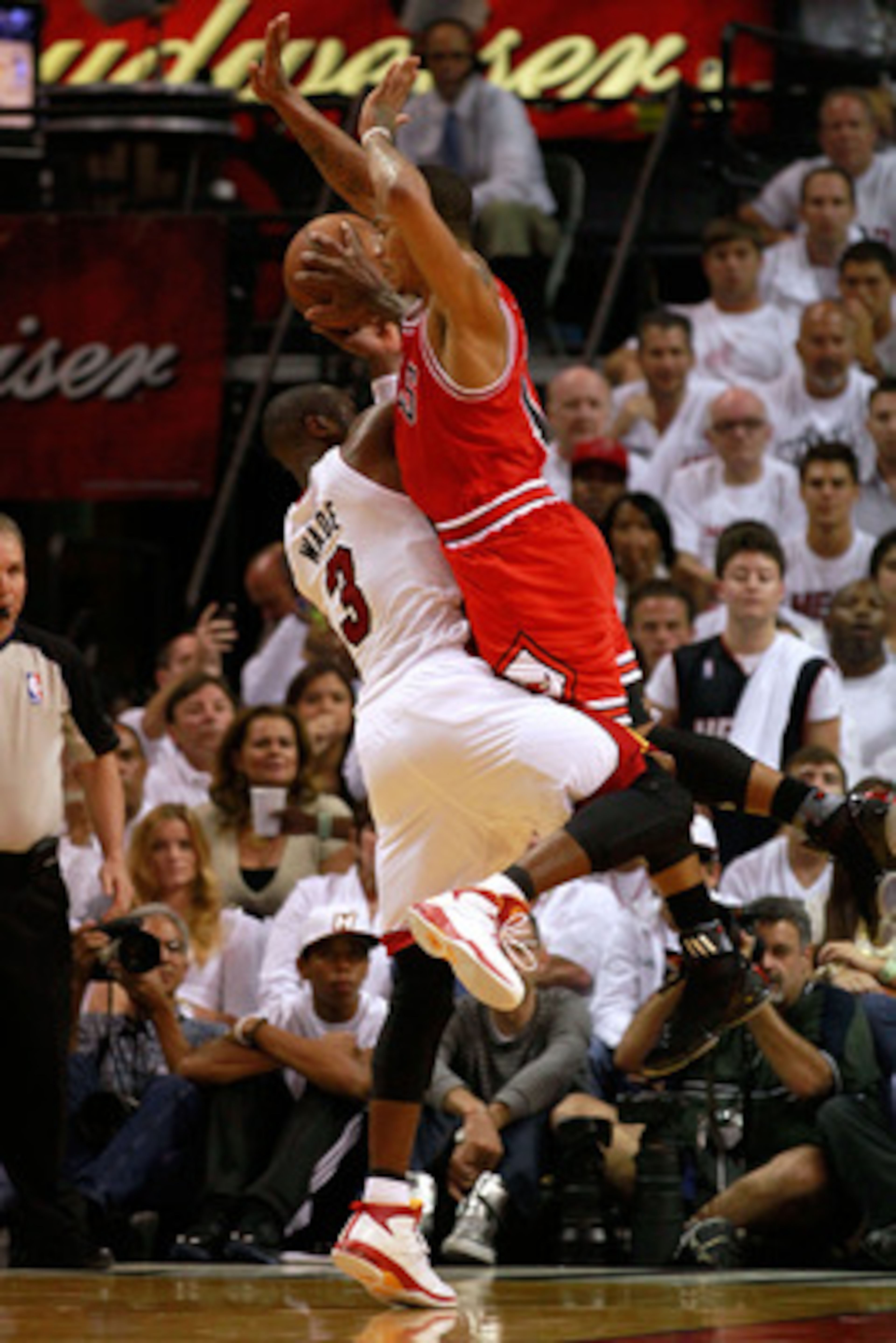 MIAMI, FL - MAY 22:  Dwyane Wade #3 of the Miami Heat attempts a shot against Derrick Rose #1 of the Chicago Bulls in Game Three of the Eastern Conference Finals during the 2011 NBA Playoffs on May 22, 2011 at American Airlines Arena in Miami, Florida.  N
