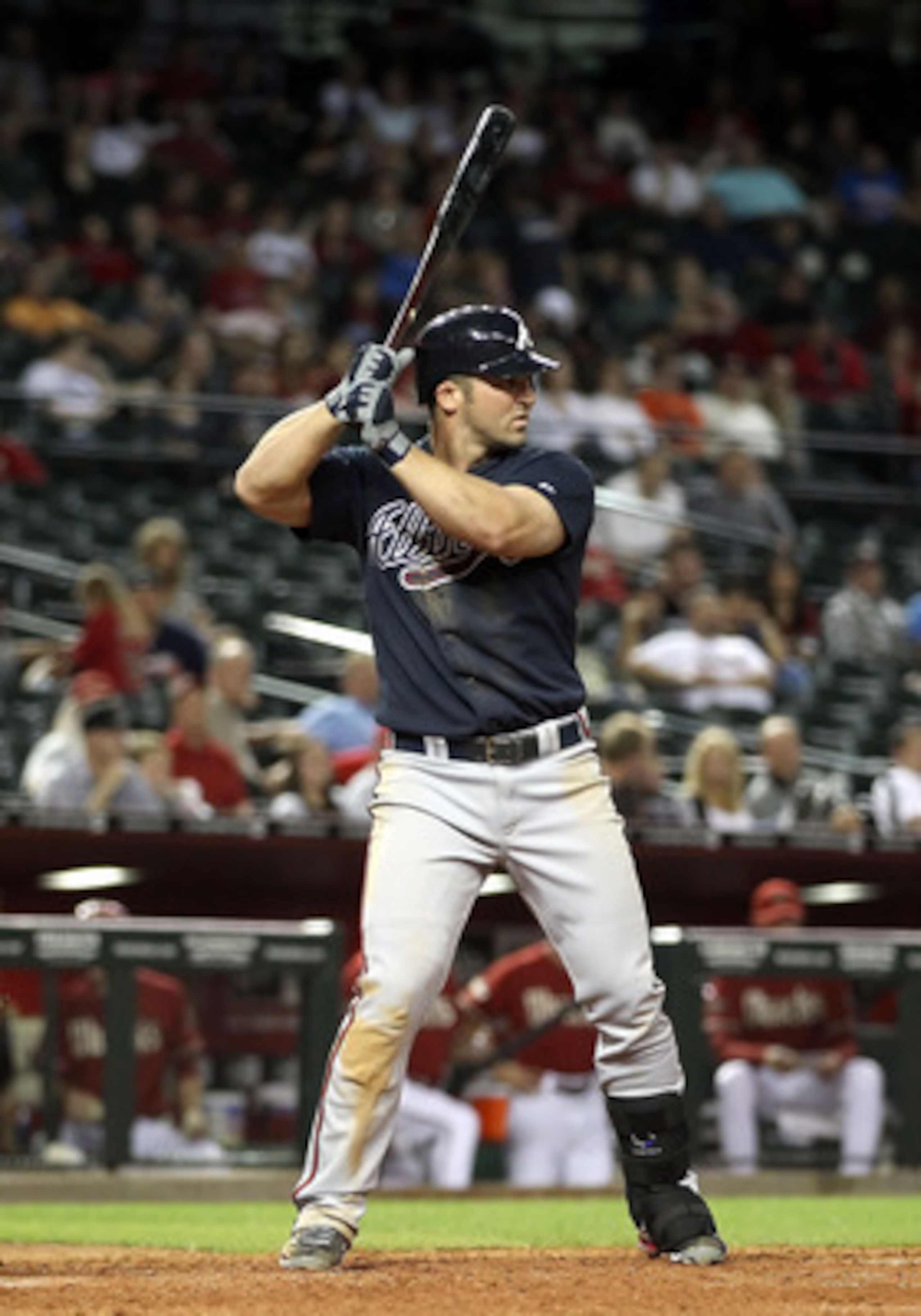 PHOENIX, AZ - MAY 18:  Dan Uggla #26 of the Atlanta Braves bats against the Arizona Diamondbacks during the Major League Baseball game at Chase Field on May 18, 2011 in Phoenix, Arizona.  The Diamondbacks defeated the Braves 5-4 in eleven innings.  (Photo