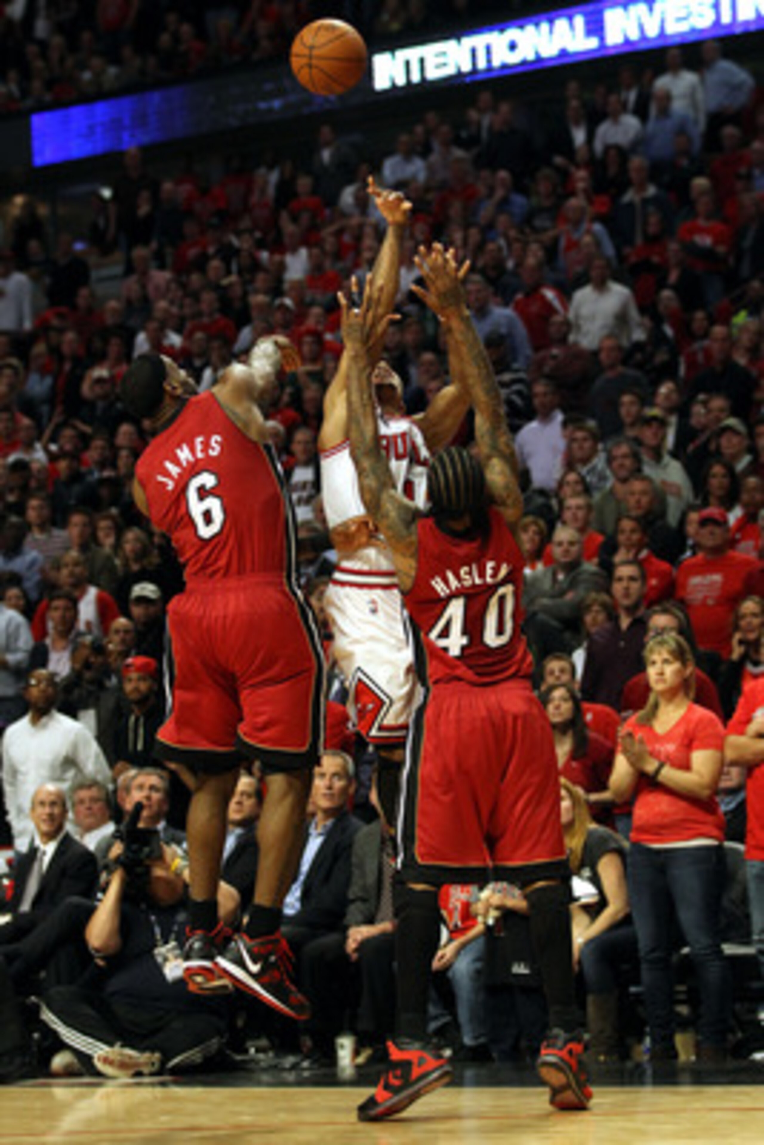 CHICAGO, IL - MAY 26:  Derrick Rose #1 of the Chicago Bulls misses the final shot attempt of the game at the buzzer against LeBron James #6 and Udonis Haslem #40 of the Miami Heat in Game Five of the Eastern Conference Finals during the 2011 NBA Playoffs 