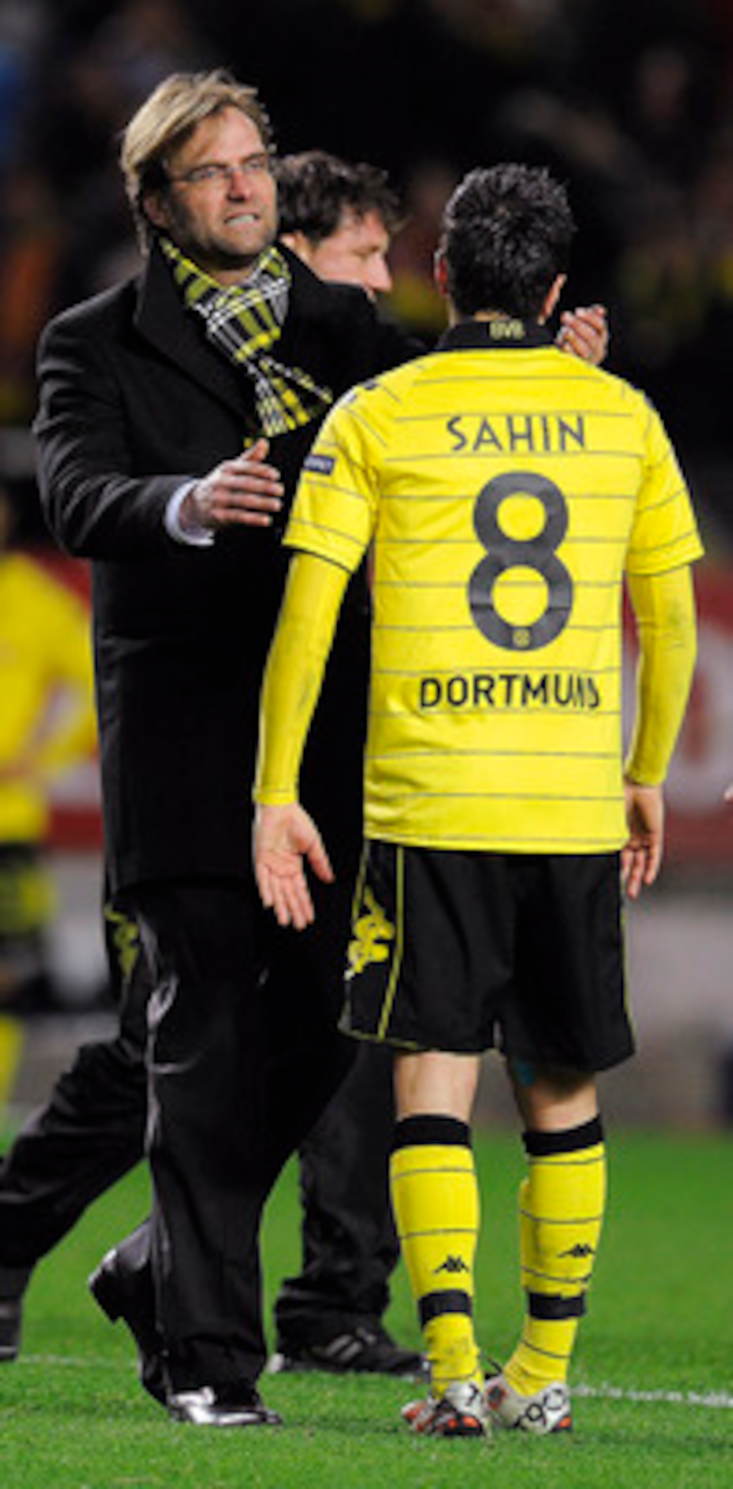 SEVILLE, SPAIN - DECEMBER 15:  Head coach Jurgen Klopp of Borussia Dortmund (L) conforts to Nuri Sahin at the end of the UEFA Europa League group J match between Sevilla and Borussia Dortmund at Estadio Ramon Sanchez Pizjuan on December 15, 2010 in Sevill