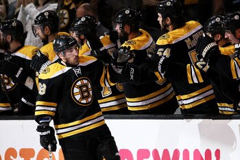 BOSTON, MA - MAY 23:  Brad Marchand #63 of the Boston Bruins celebrates his second period goal against the Tampa Bay Lightning with teammates in Game Five of the Eastern Conference Finals during the 2011 NHL Stanley Cup Playoffs at TD Garden on May 23, 20