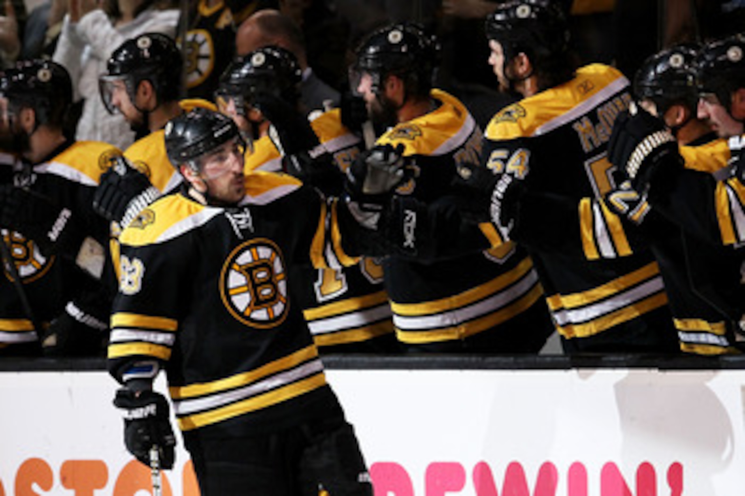 BOSTON, MA - MAY 23:  Brad Marchand #63 of the Boston Bruins celebrates his second period goal against the Tampa Bay Lightning with teammates in Game Five of the Eastern Conference Finals during the 2011 NHL Stanley Cup Playoffs at TD Garden on May 23, 20