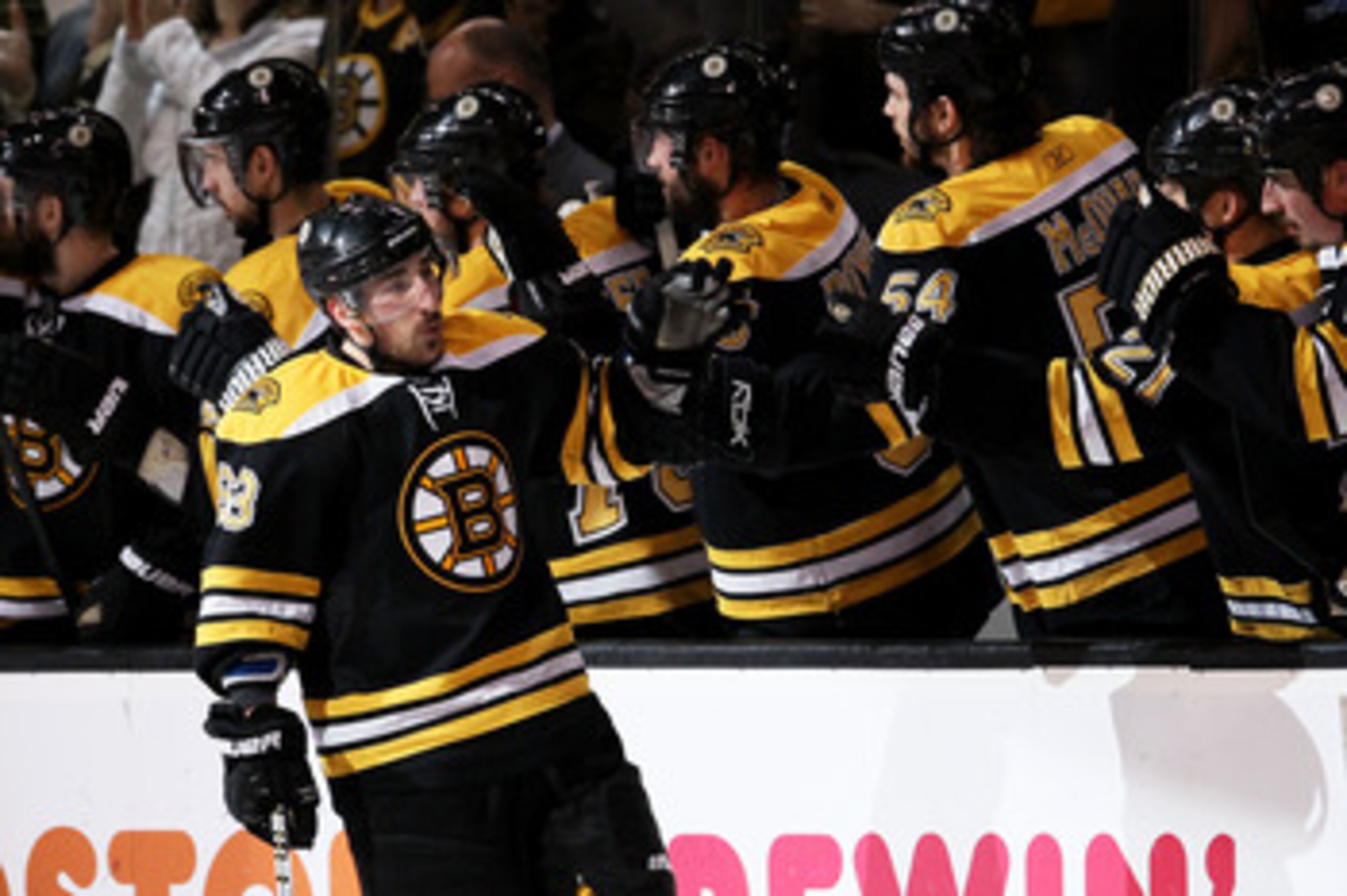 BOSTON, MA - MAY 23:  Brad Marchand #63 of the Boston Bruins celebrates his second period goal against the Tampa Bay Lightning with teammates in Game Five of the Eastern Conference Finals during the 2011 NHL Stanley Cup Playoffs at TD Garden on May 23, 20