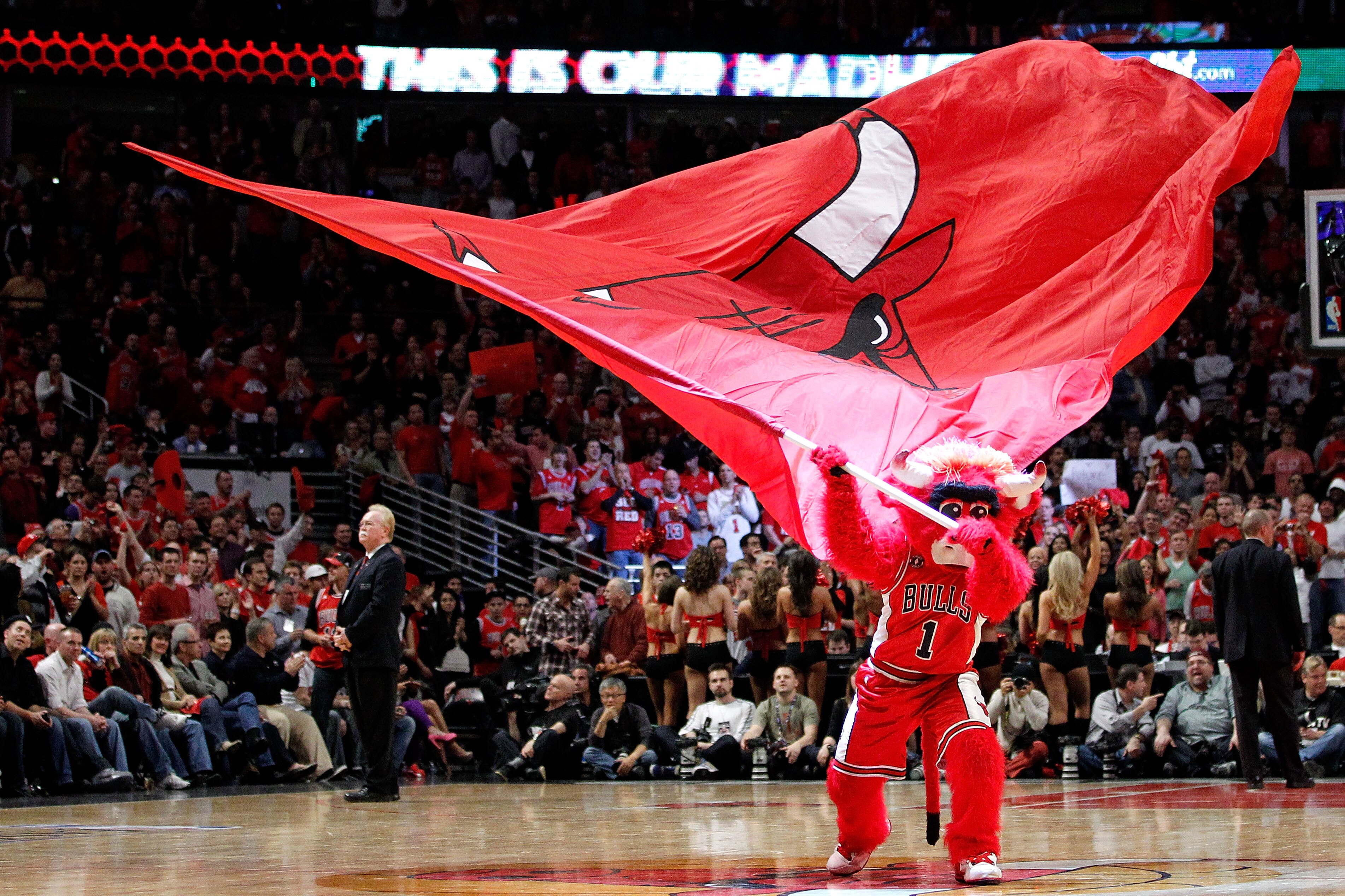 CHICAGO, IL - MAY 15: Benny the Bull mascot for the Chicago Bulls waves a giant flag as he performs against the Miami Heat in Game One of the Eastern Conference Finals during the 2011 NBA Playoffs on May 15, 2011 at the United Center in Chicago, Illinois.