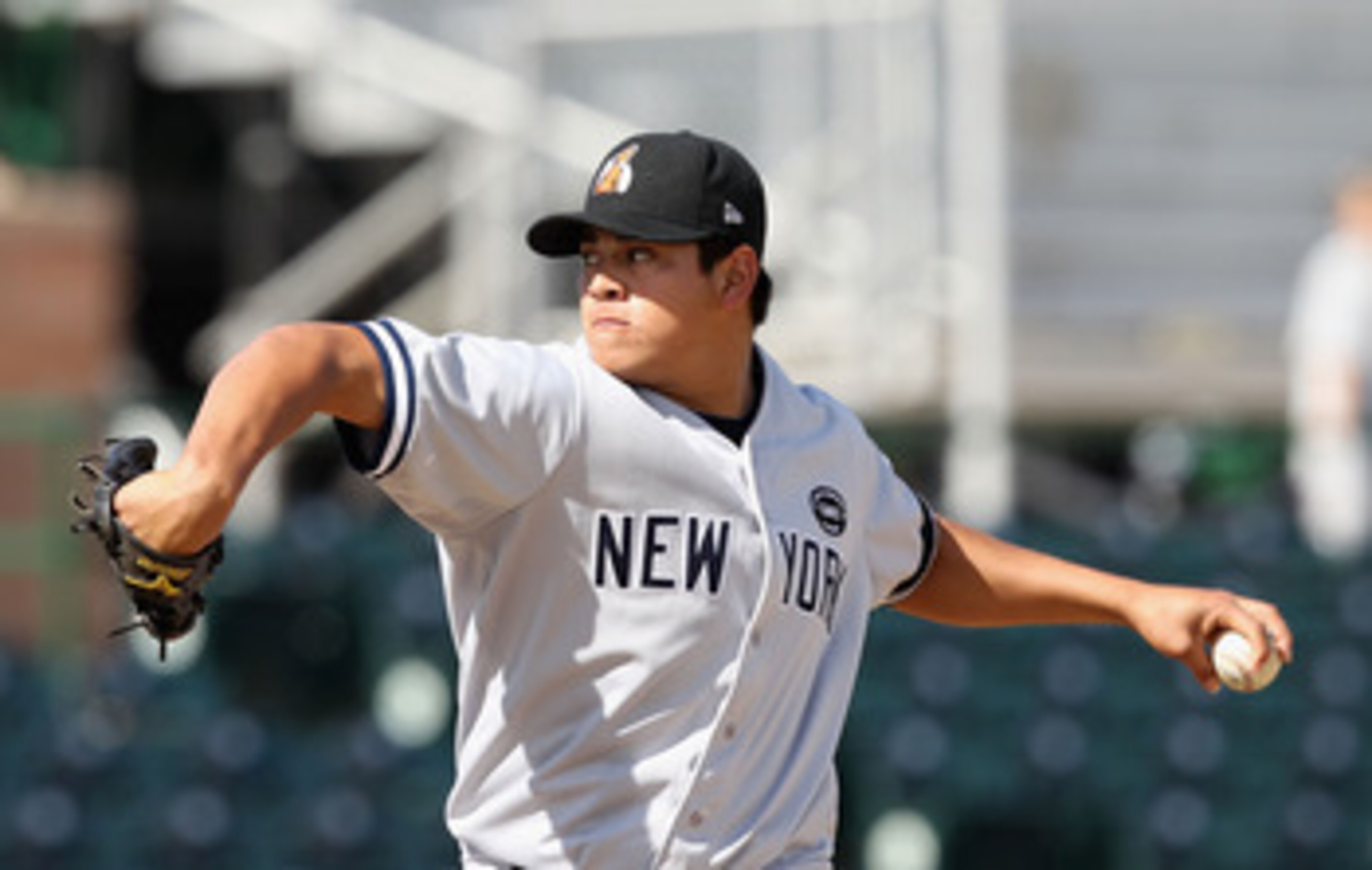 SCOTTSDALE, AZ - OCTOBER 23:  New York Yankees prospect Manuel Banuelos playing for the Phoenix Desert Dogs pitches against the Scottsdale Scorpions during the AZ Fall League game at Scottsdale Stadium on October 23, 2010 in Scottsdale, Arizona.  (Photo b