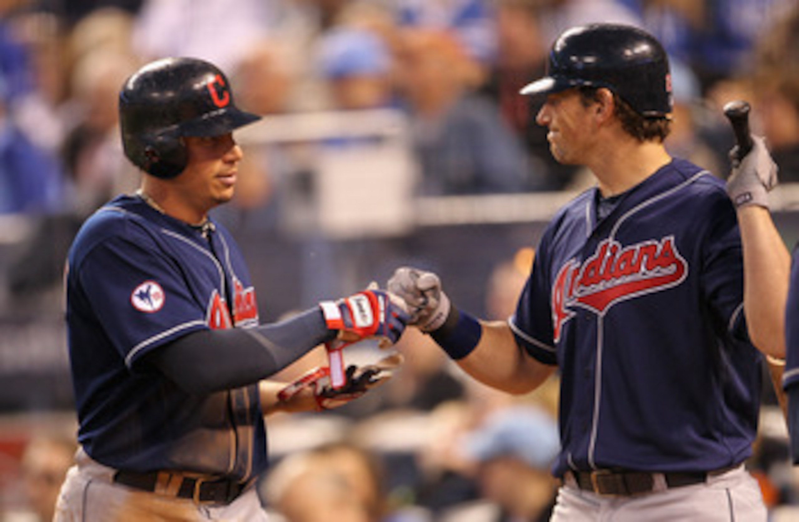 KANSAS CITY, MO - MAY 16:  Asdrubal Cabrera #13 of the Cleveland Indians is congratulated by Travis Buck #28 after scoring during the 4th inning of the game against the Kansas City Royals on May 16, 2011 at Kauffman Stadium in Kansas City, Missouri.  (Pho