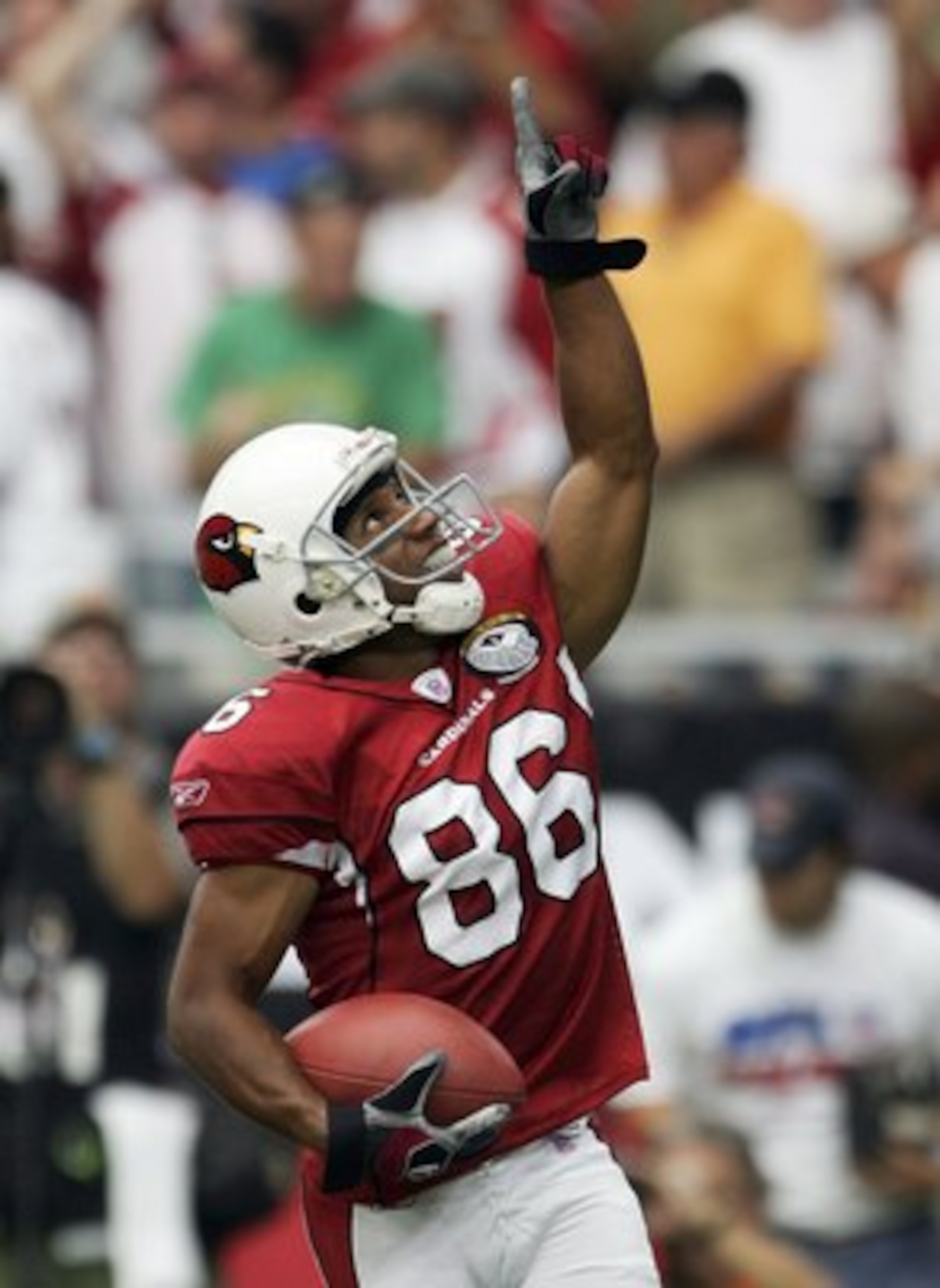 PHOENIX - SEPTEMBER 10:  Troy Walters #86 of the Arizona Cardinals celebrates his touchdown against the San Francisco 49ers during the first quarter in the season opening game at Cardinals Stadium on September 10, 2006 in Phoenix, Arizona.  (Photo by Harr