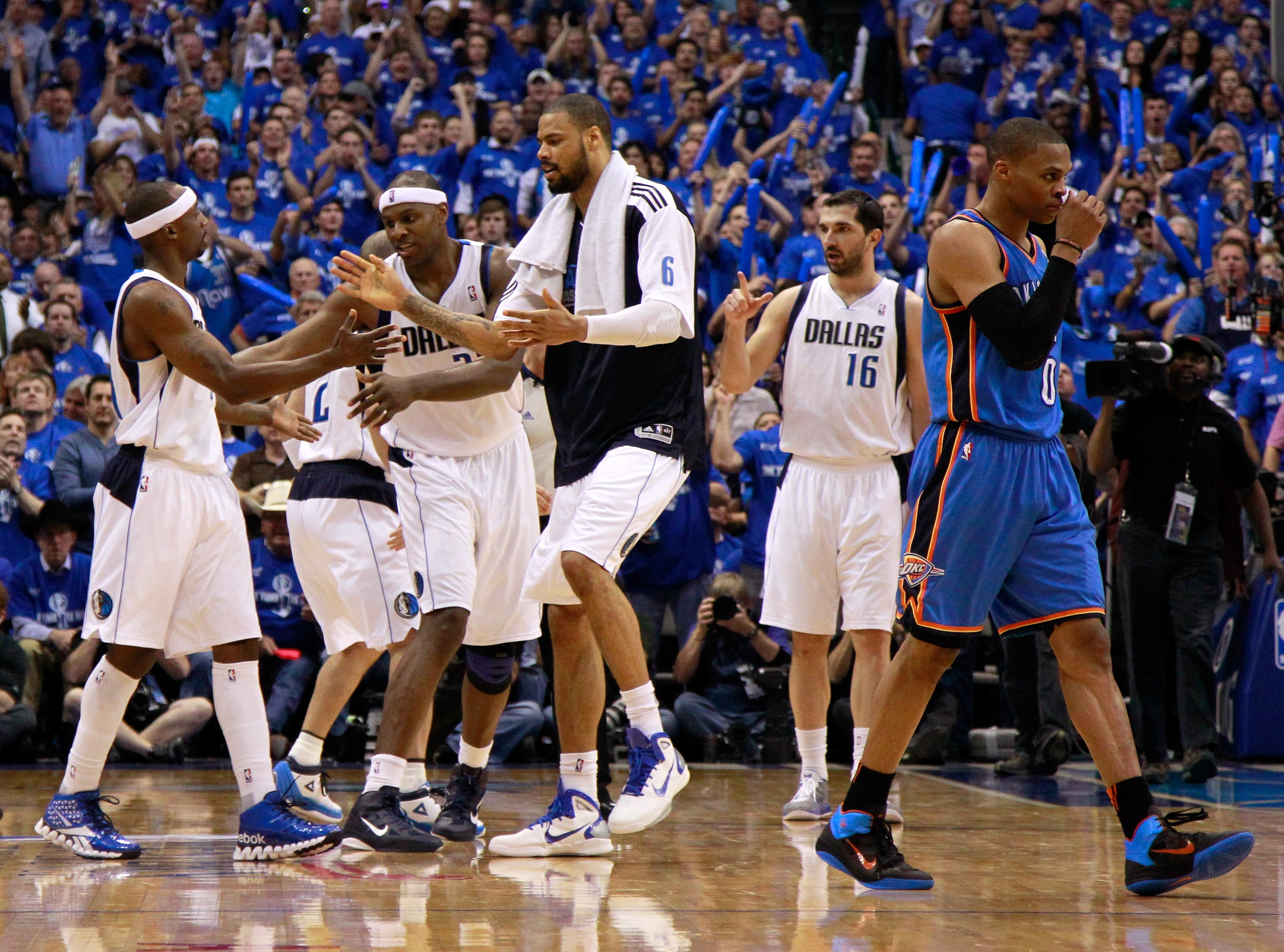 DALLAS, TX - MAY 25:  Jason Terry #31, Brendan Haywood #33 and Tyson Chandler #6 of the Dallas Mavericks react on the court in the third quarter as Russell Westbrook #0 of the Oklahoma City Thunder walks by in Game Five of the Western Conference Finals du