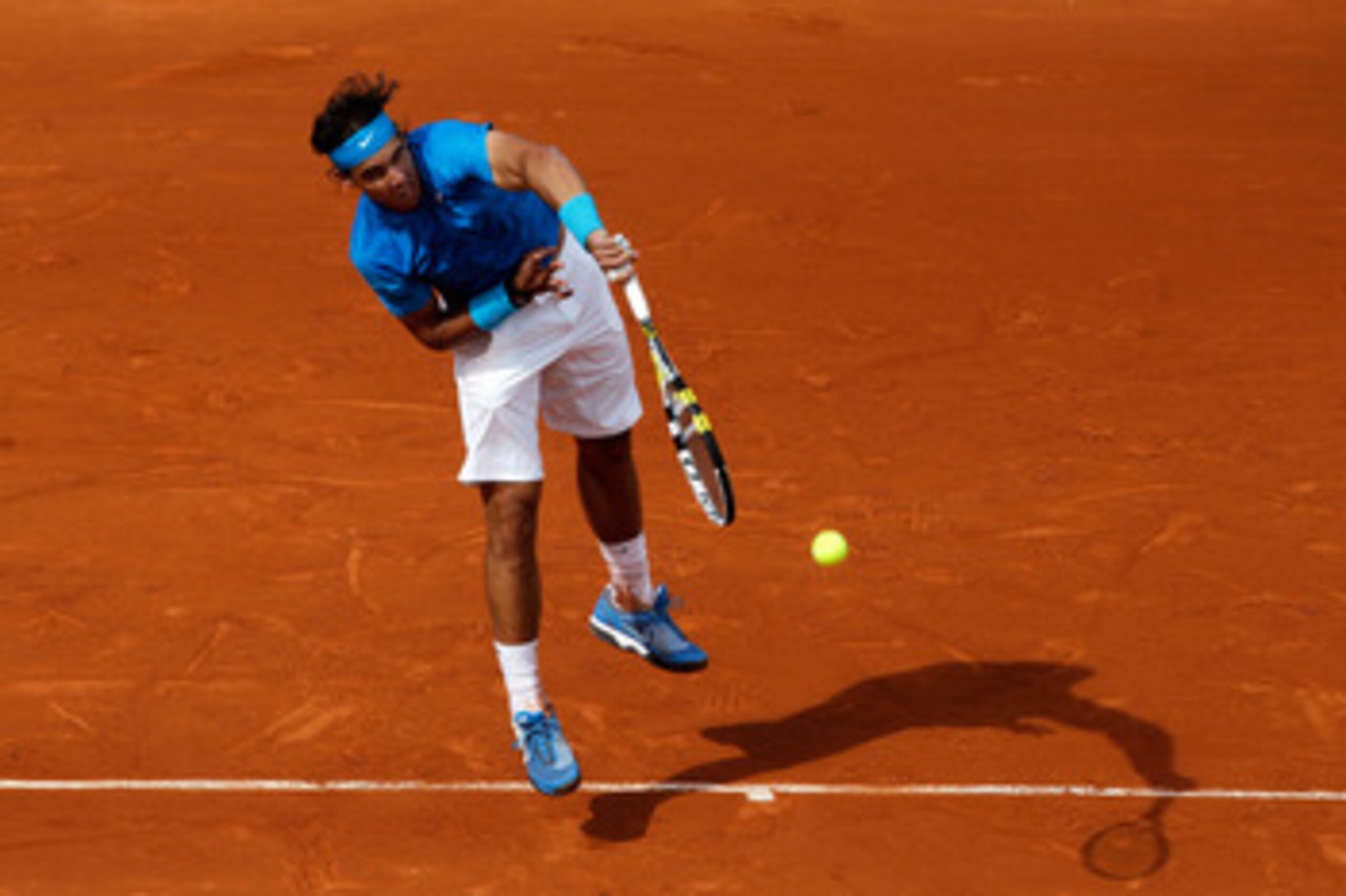PARIS, FRANCE - MAY 26:  Rafael Nadal of Spain serves during the men's singles round two match between Rafael Nadal of Spain and Pablo Andujar of Spain on day five of the French Open at Roland Garros on May 26, 2011 in Paris, France.  (Photo by Matthew St