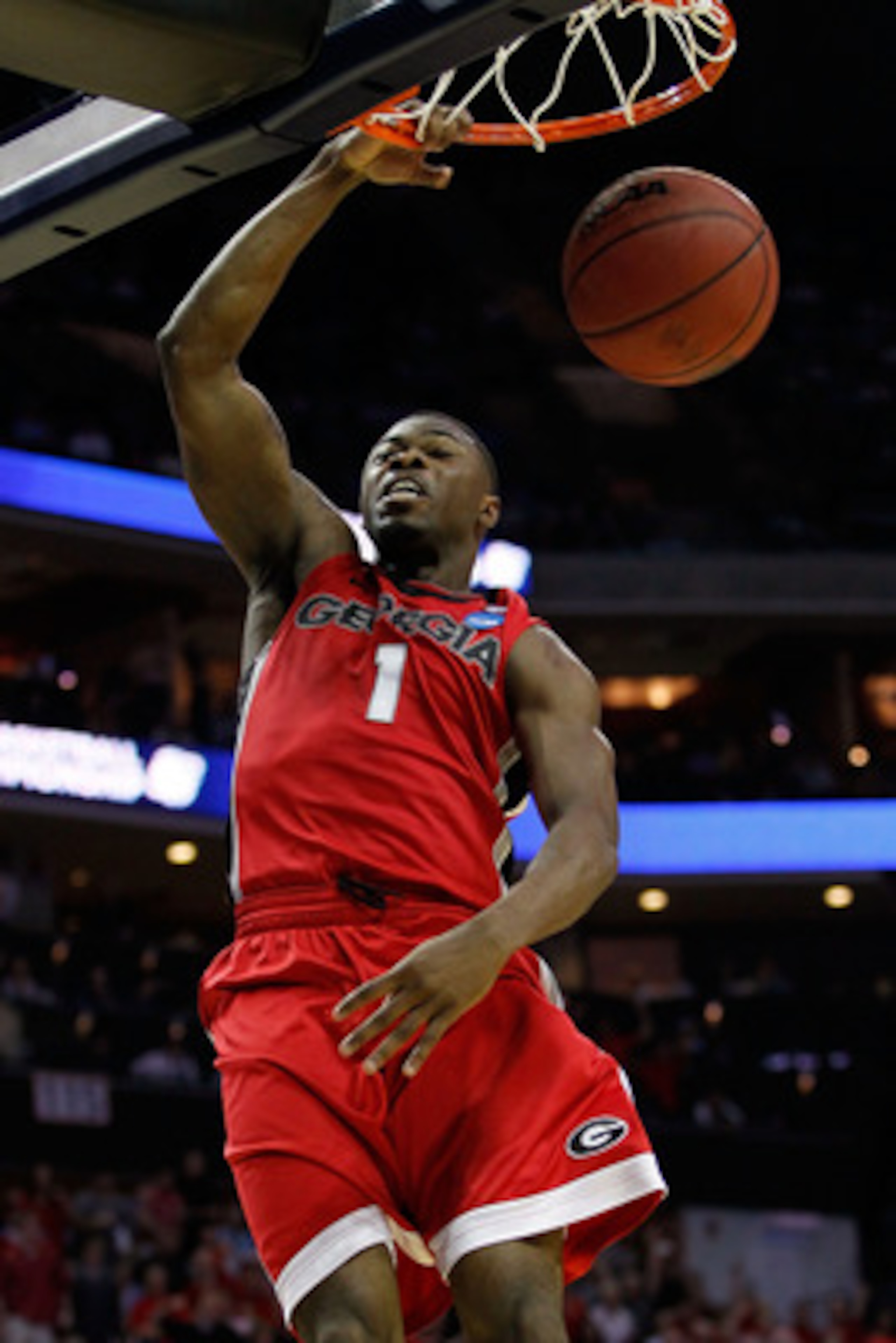 CHARLOTTE, NC - MARCH 18:  Travis Leslie #1 of the Georgia Bulldogs dunks the ball in the first half while taking on the Washington Huskies during the second round of the 2011 NCAA men's basketball tournament at Time Warner Cable Arena on March 18, 2011 i