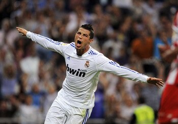 MADRID, SPAIN - MAY 21:  Cristiano Ronaldo of Real Madrid celebrates after scoring his 2nd goal during the La Liga match between Real Madrid and UD Almeria at Estadio Santiago Bernabeu on May 21, 2011 in Madrid, Spain.  (Photo by Denis Doyle/Getty Images)