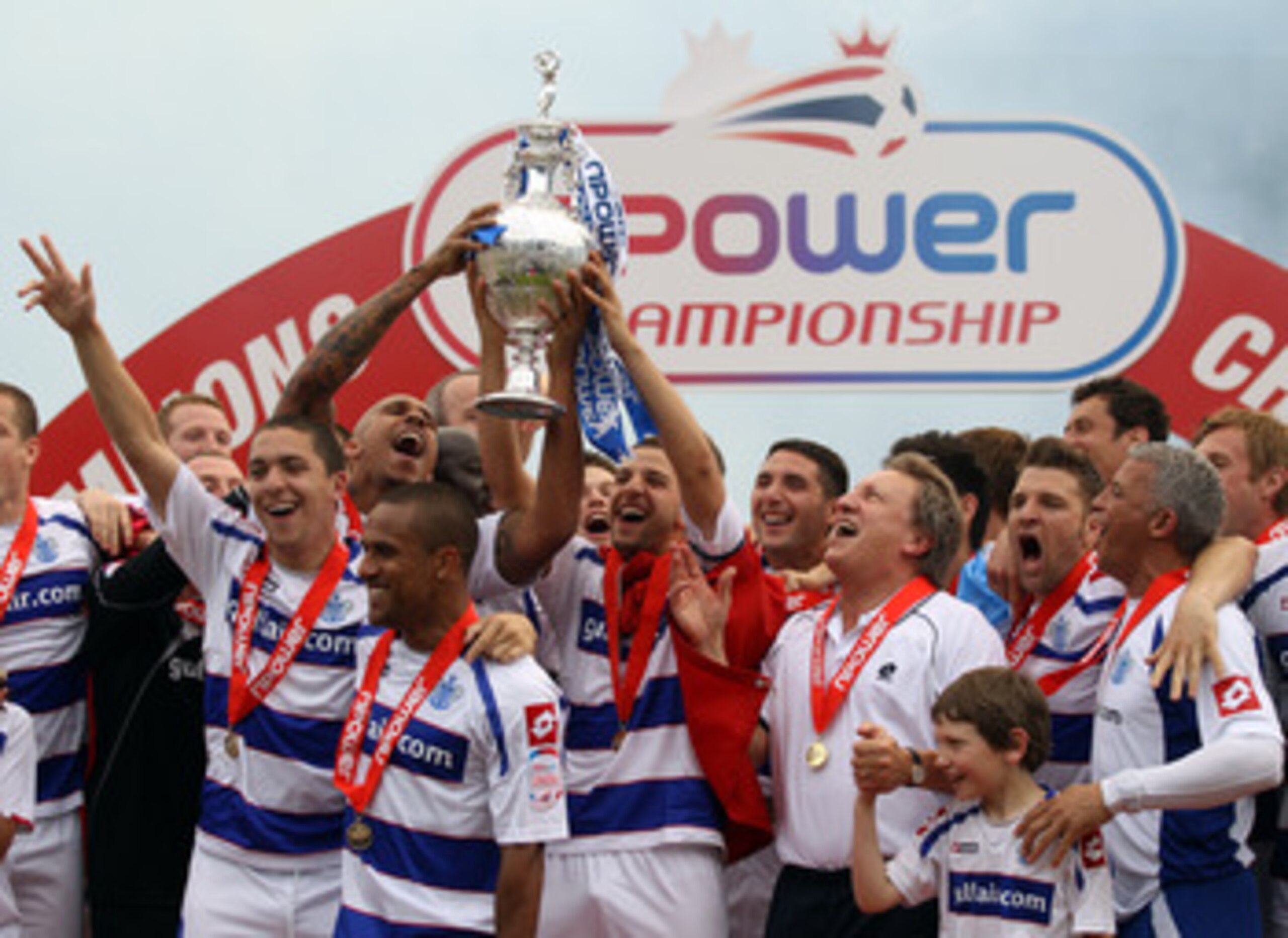 LONDON, ENGLAND - MAY 07: Queens Park Rangers players celebrates with the trophy after winning the npower Championship match between Queens Park Rangers and Leeds United at Loftus Road on May 7, 2011 in London, England. (Photo by Ian Walton/Getty Images LONDON, ENGLAND - MAY 07: Queens Park Rangers players celebrates with the trophy after winning the npower Championship match between Queens Park Rangers and Leeds United at Loftus Road on May 7, 2011 in London, England. (Photo by Ian Walton/Getty Images