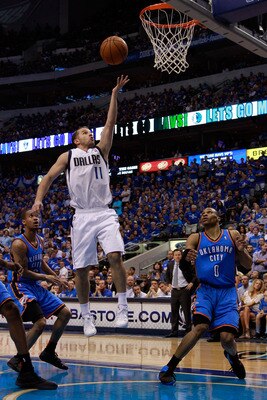 DALLAS, TX - MAY 25:  Jose Juan Barea #11 of the Dallas Mavericks goes up for a shot over Russell Westbrook #0 of the Oklahoma City Thunder in the second half in Game Five of the Western Conference Finals during the 2011 NBA Playoffs at American Airlines 