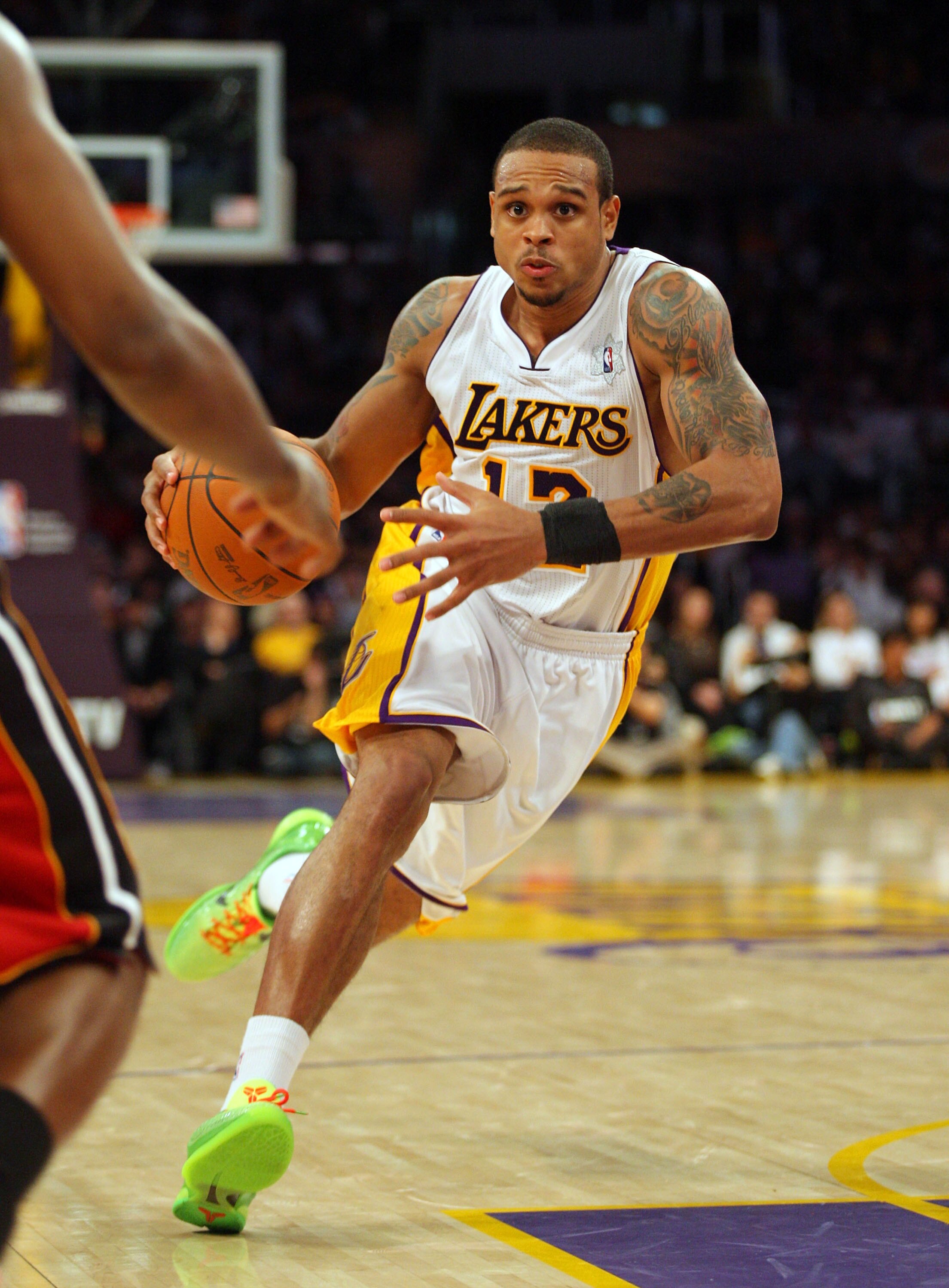 LOS ANGELES, CA - DECEMBER 25:  Shannon Brown #12 of the Los Angeles Lakers makes a move to the basket against the Miami Heat during the NBA game at Staples Center on December 25, 2010 in Los Angeles, California. The Heat defeated the Lakers 96-80.  NOTE