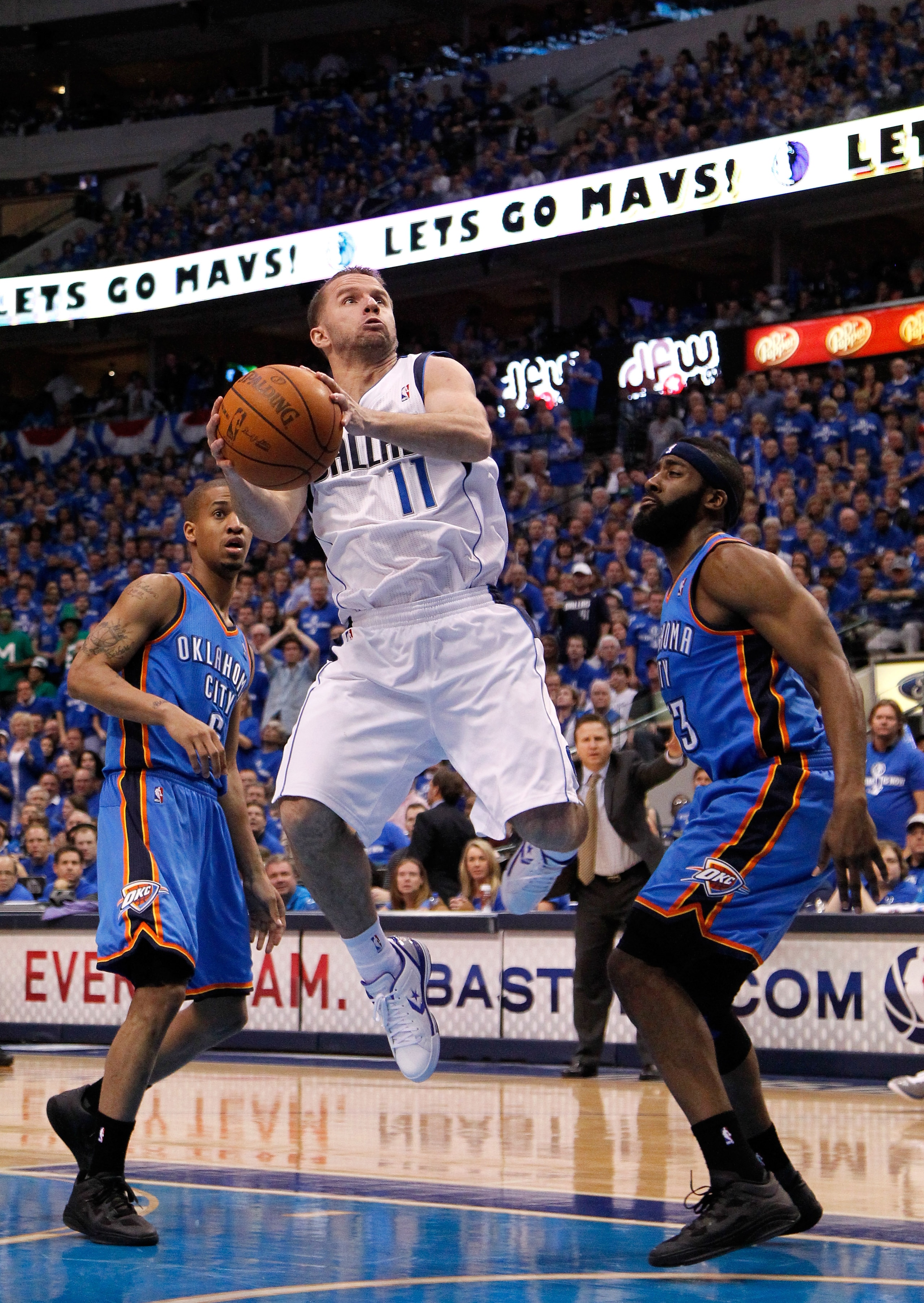 DALLAS, TX - MAY 17:  Jose Juan Barea #11 of the Dallas Mavericks goes up for a shot against James Harden #13 of the Oklahoma City Thunder in Game One of the Western Conference Finals during the 2011 NBA Playoffs at American Airlines Center on May 17, 201