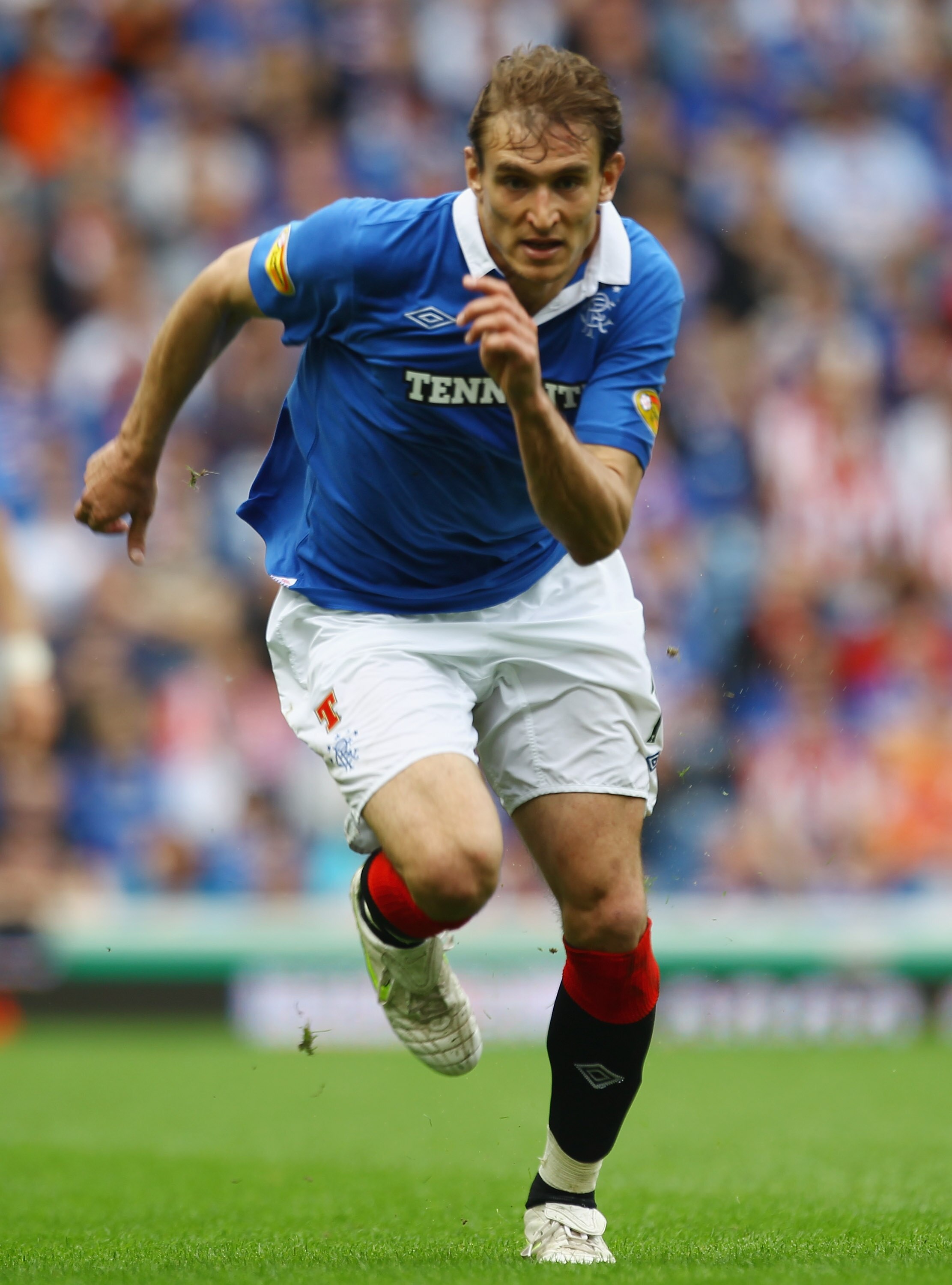GLASGOW, SCOTLAND - MAY 07:  Nikica Jelavic of Rangers in action during the Clydesdale Bank Premier League match between Rangers and Hearts at Ibrox Stadium salutes his supporters on May 7, 2011 in Glasgow, Scotland.  (Photo by Jeff J Mitchell/Getty Image