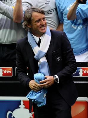 LONDON, ENGLAND - MAY 14:  Roberto Mancini smiles after his Manchester City team won the FA Cup sponsored by E.ON Final match between Manchester City and Stoke City at Wembley Stadium on May 14, 2011 in London, England.  (Photo by Alex Livesey/Getty Image