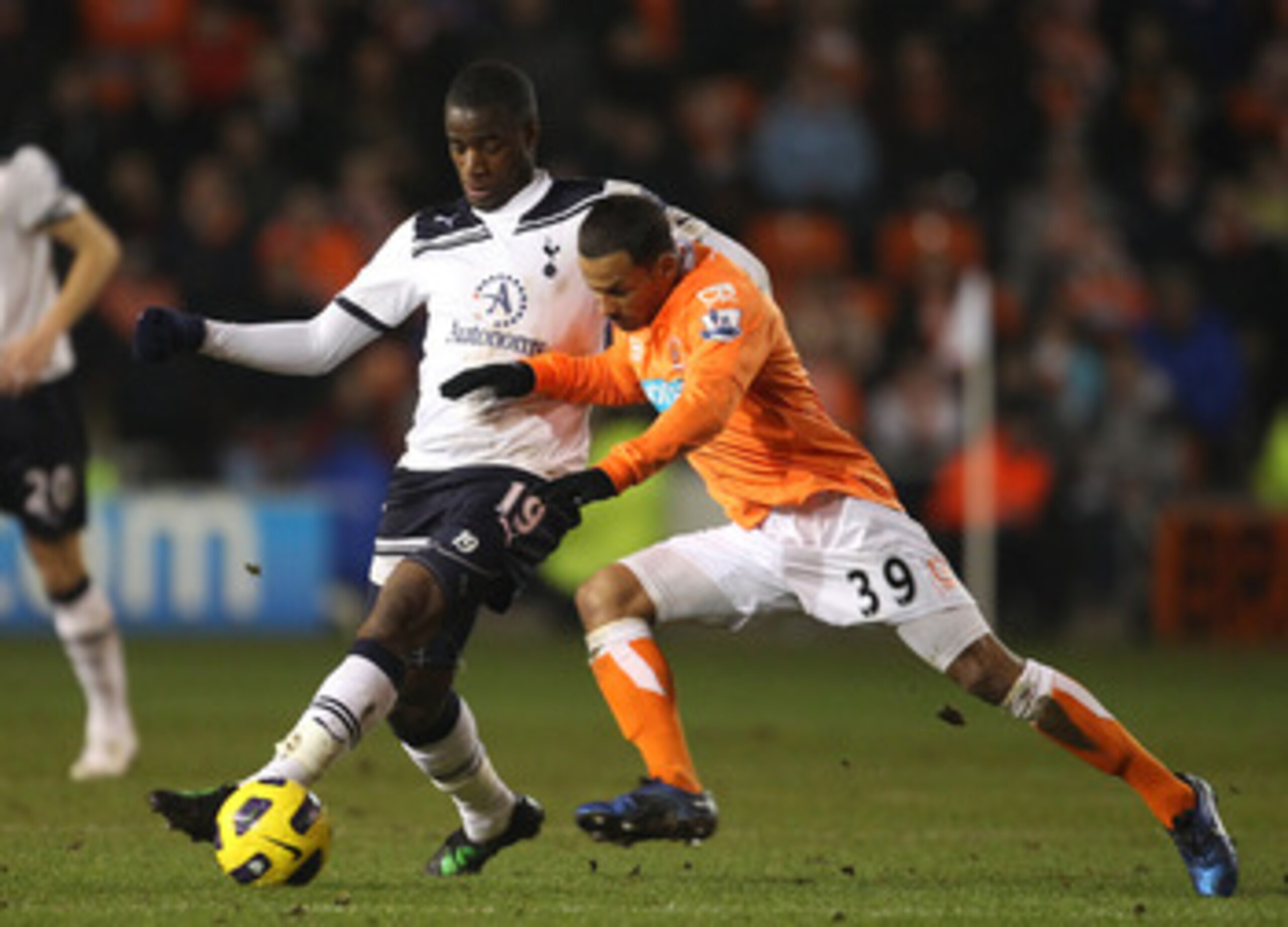 BLACKPOOL, ENGLAND - FEBRUARY 22: DJ Campbell of Blackpool battles for the ball with Sebastien Bassong of Tottenham Hotspur during the Barclays Premier League match between Blackpool and Tottenham Hotspur at Bloomfield Road on February 22, 2011 in Blackp BLACKPOOL, ENGLAND - FEBRUARY 22: DJ Campbell of Blackpool battles for the ball with Sebastien Bassong of Tottenham Hotspur during the Barclays Premier League match between Blackpool and Tottenham Hotspur at Bloomfield Road on February 22, 2011 in Blackp