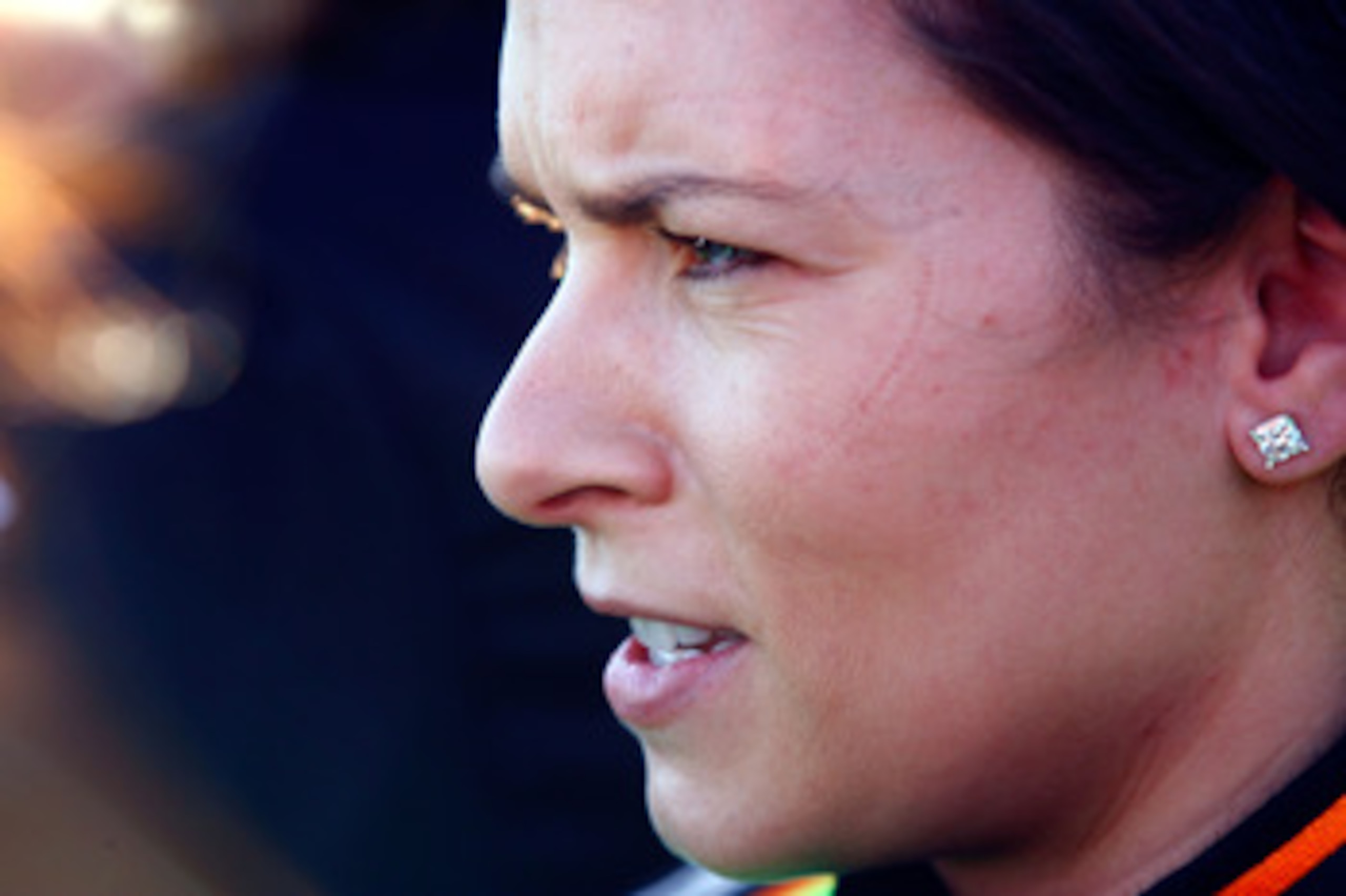 DAYTONA BEACH, FL - FEBRUARY 18:  Danica Patrick, driver of the #7 GoDaddy.com Chevrolet, looks on in the garage area after driving during qualifying for the NASCAR Nationwide Series DRIVE4COPD 300 at Daytona International Speedway on February 18, 2011 in