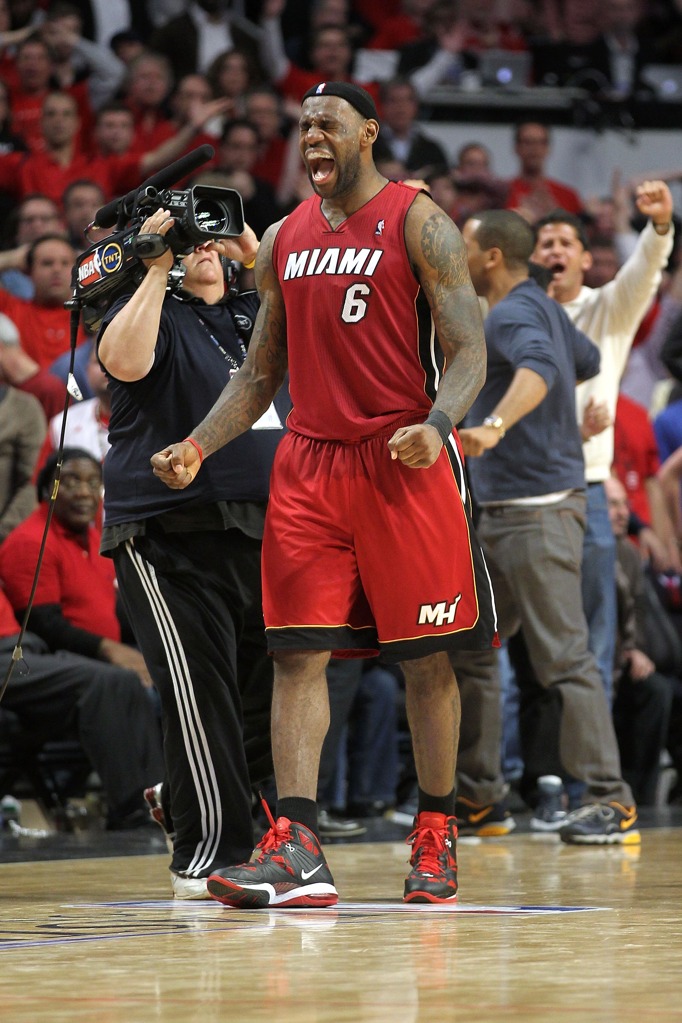 CHICAGO, IL - MAY 26: LeBron James #6 of the Miami Heat celebrates after the Heat won 83-80 against the Chicago Bulls in Game Five of the Eastern Conference Finals during the 2011 NBA Playoffs on May 26, 2011 at the United Center in Chicago, Illinois. NOT