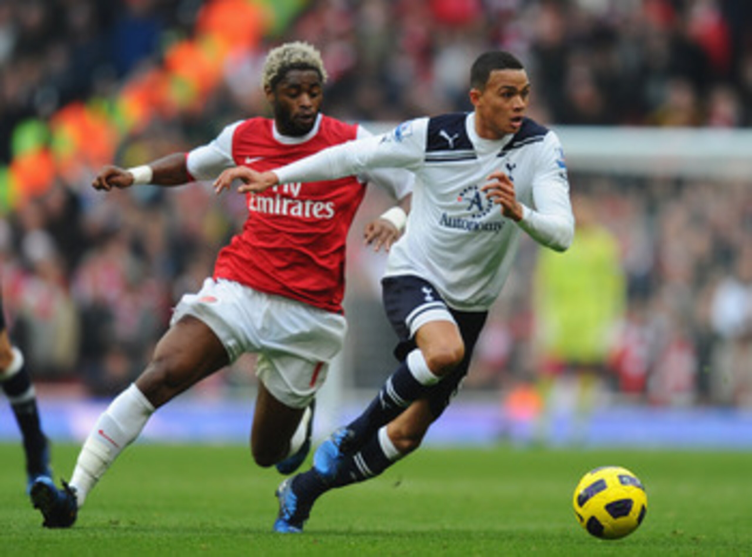 LONDON, ENGLAND - NOVEMBER 20: Jermaine Jenas of Tottenham gets away from Alex Song of Arsenal during the Barclays Premier League match between Arsenal and Tottenham Hotspur at the Emirates Stadium on November 20, 2010 in London, England. (Photo by Mike LONDON, ENGLAND - NOVEMBER 20: Jermaine Jenas of Tottenham gets away from Alex Song of Arsenal during the Barclays Premier League match between Arsenal and Tottenham Hotspur at the Emirates Stadium on November 20, 2010 in London, England. (Photo by Mike