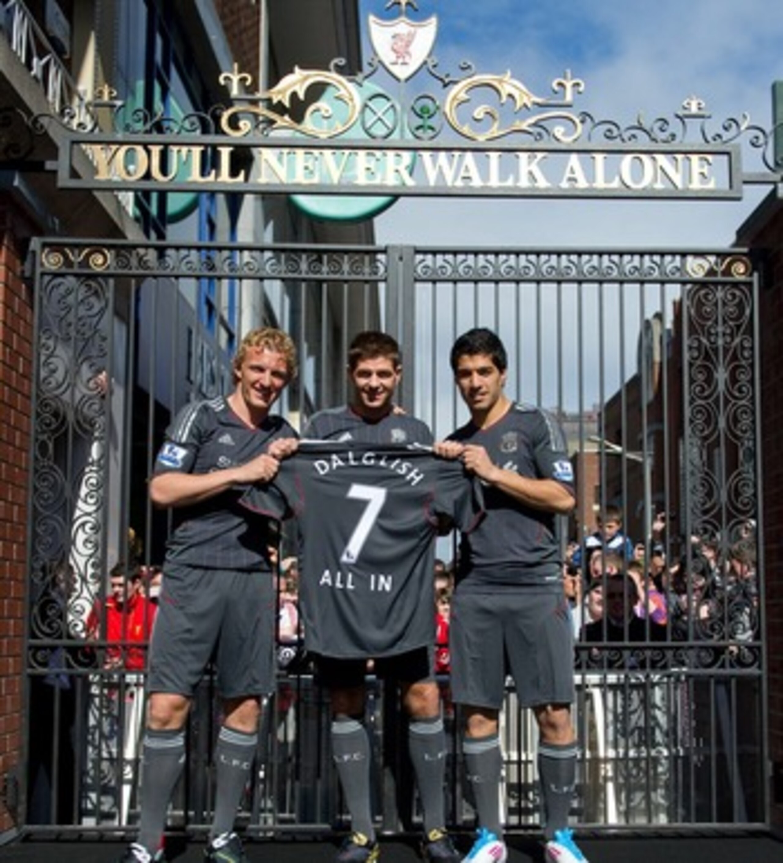 DUBLIN, IRELAND - MAY 12:  (L-R) Dirk Kuyt, Steven Gerrard and Luis Suarez of Liverpool FC launch the new Liverpool away kit in front of the Shankly Gates as adidas bring iconic pieces from Liverpool FC to the city on May 12, 2001 in Dublin, Ireland.  (Ph