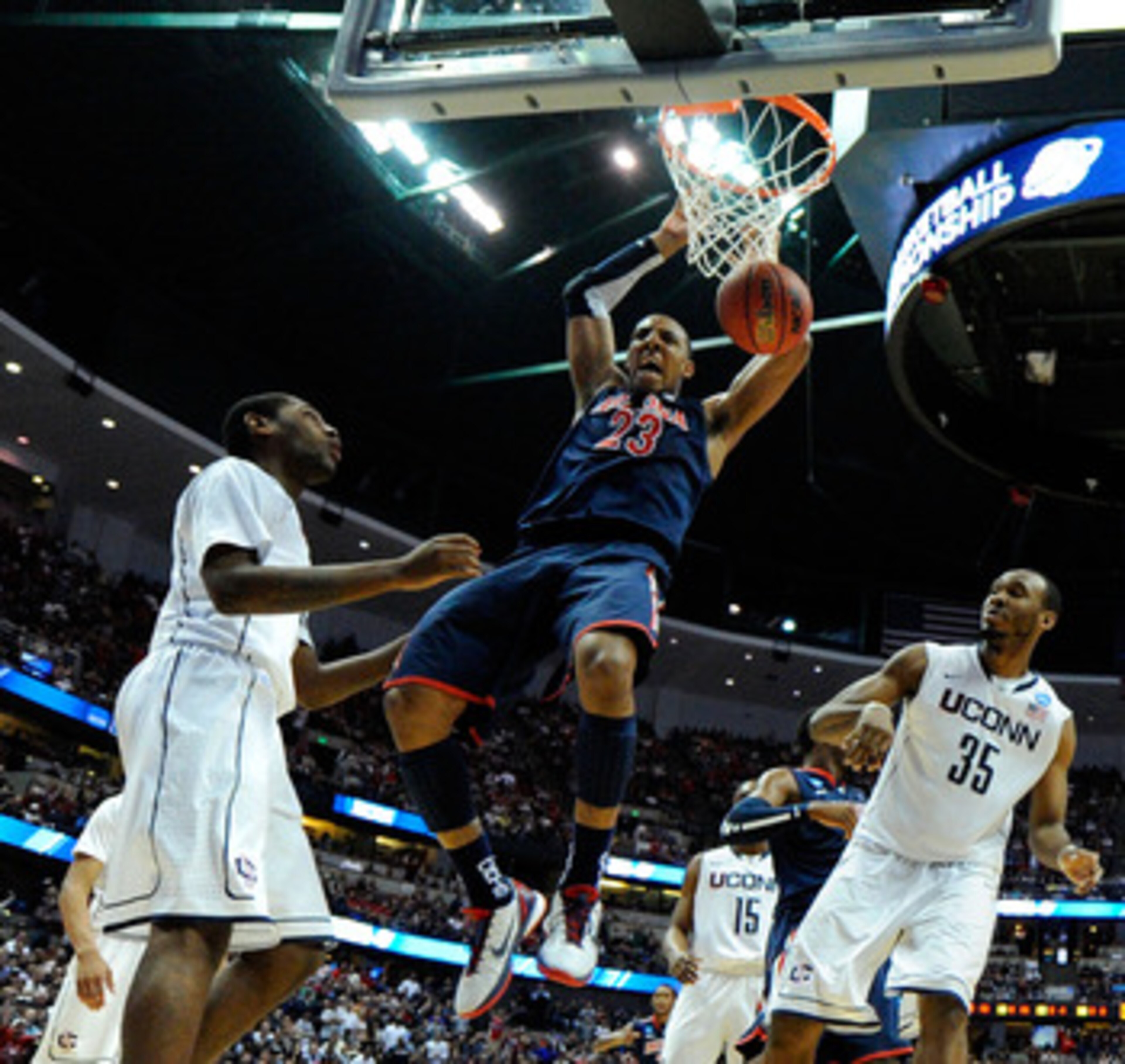 ANAHEIM, CA - MARCH 26: Derrick Williams #23 of the Arizona Wildcats dunks the ball against Roscoe Smith #22 and Charles Okwandu #35 of the Connecticut Huskies during the west regional final of the 2011 NCAA men's basketball tournament at the Honda Cente ANAHEIM, CA - MARCH 26: Derrick Williams #23 of the Arizona Wildcats dunks the ball against Roscoe Smith #22 and Charles Okwandu #35 of the Connecticut Huskies during the west regional final of the 2011 NCAA men's basketball tournament at the Honda Cente