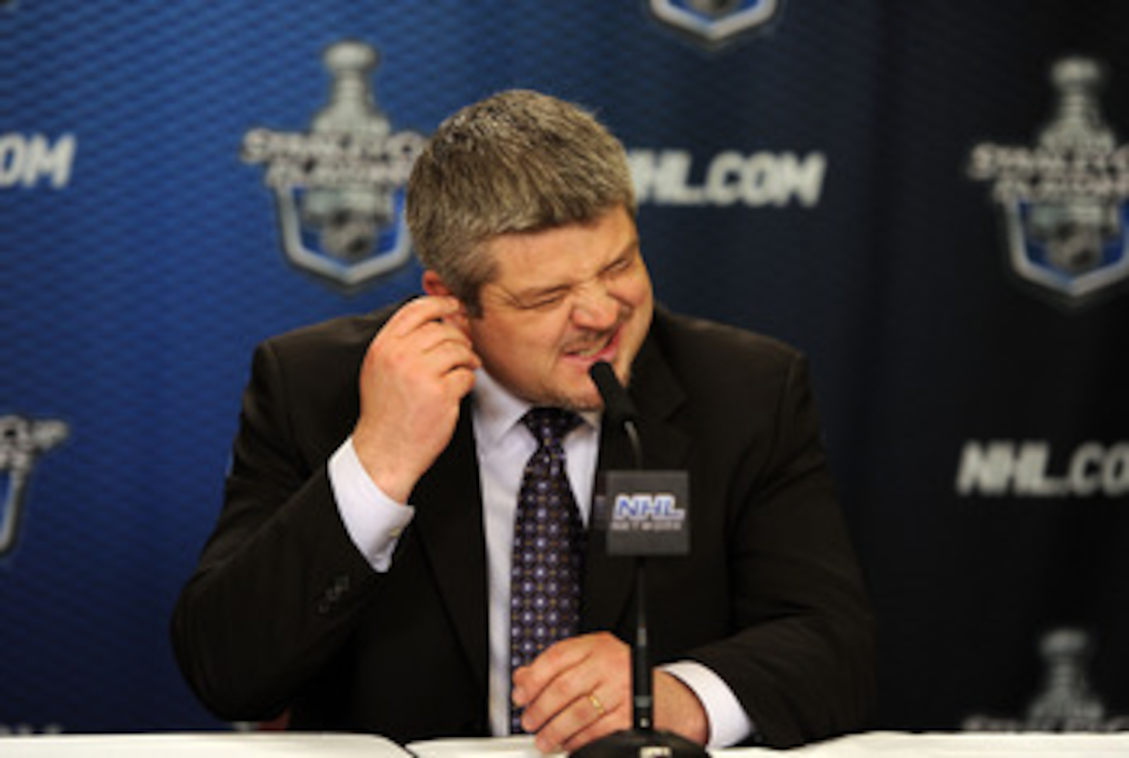 VANCOUVER, CANADA - MAY 24:  Head Coach Todd McLellan of the San Jose Sharks grimaces during the post game press conference after the Vancouver Canucks won Game Five of the Western Conference Finals 3-2 in the second overtime to win the series 4-1 against