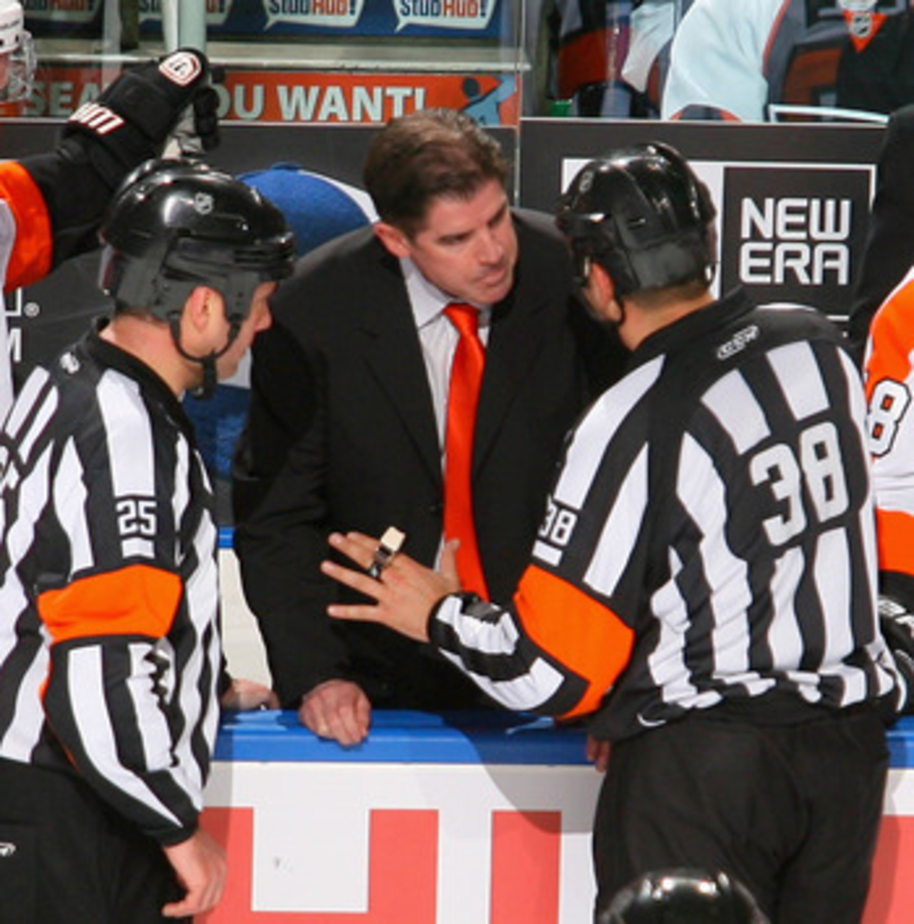 BUFFALO, NY - APRIL 20:  Head coach Peter Laviolette of the Philadelphia Flyers argues a penalty call with referee Francois St. Laurent #38 aginst the Buffalo Sabres  in Game Four of the Eastern Conference Quarterfinals during the 2011 NHL Stanley Cup Pla