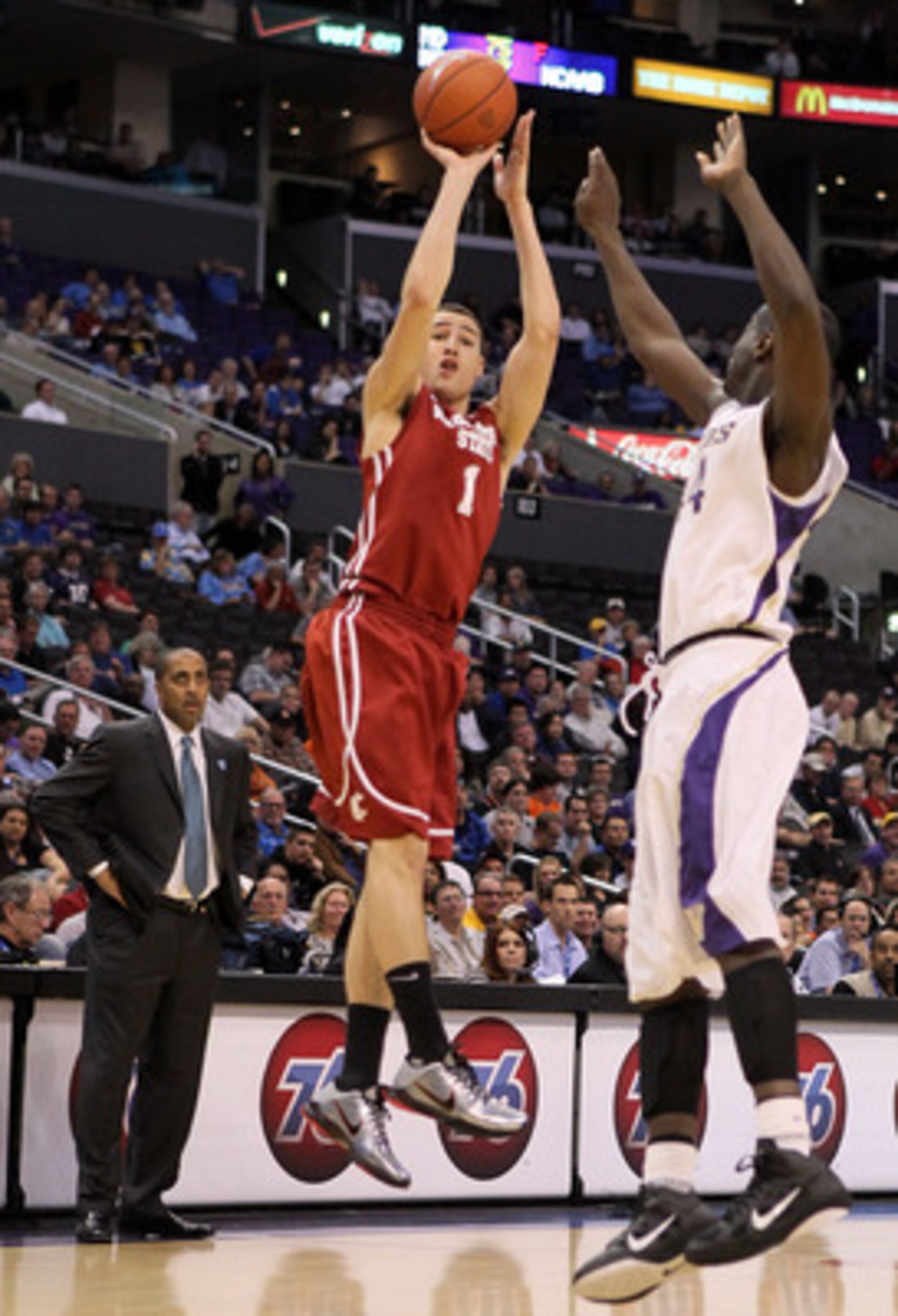 LOS ANGELES, CA - MARCH 10:  Klay Thompson #1 of the Washington State Cougars shoots over Darnell Gant #44 of the Washington Huskies in the first half in the quarterfinals of the 2011 Pacific Life Pac-10 Men's Basketball Tournament at Staples Center on Ma