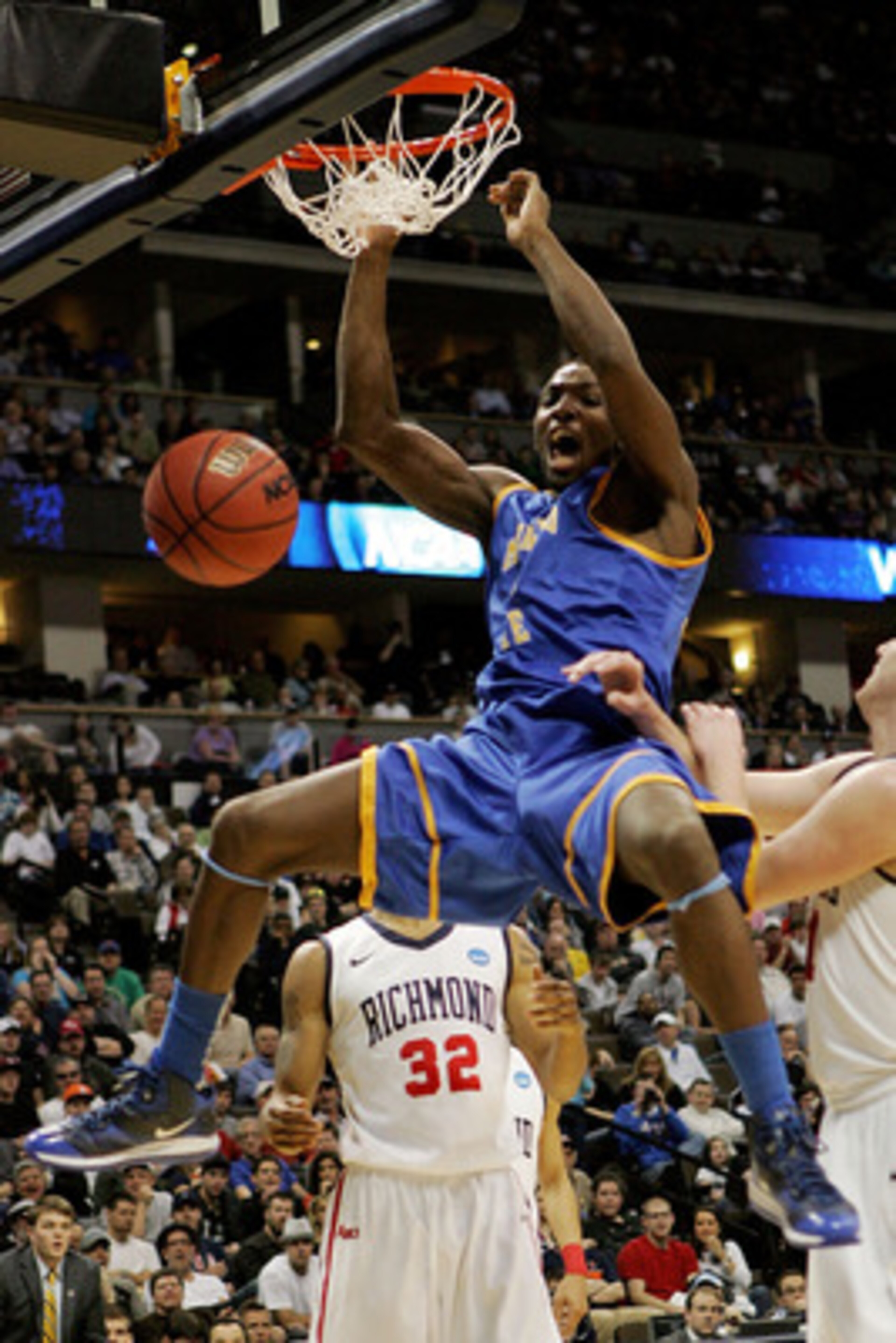DENVER, CO - MARCH 19: Kenneth Faried #35 of the Morehead State Eagles dunks the ball against the Richmond Spiders during the third round of the 2011 NCAA men's basketball tournament at Pepsi Center on March 19, 2011 in Denver, Colorado. (Photo by Justi DENVER, CO - MARCH 19: Kenneth Faried #35 of the Morehead State Eagles dunks the ball against the Richmond Spiders during the third round of the 2011 NCAA men's basketball tournament at Pepsi Center on March 19, 2011 in Denver, Colorado. (Photo by Justi